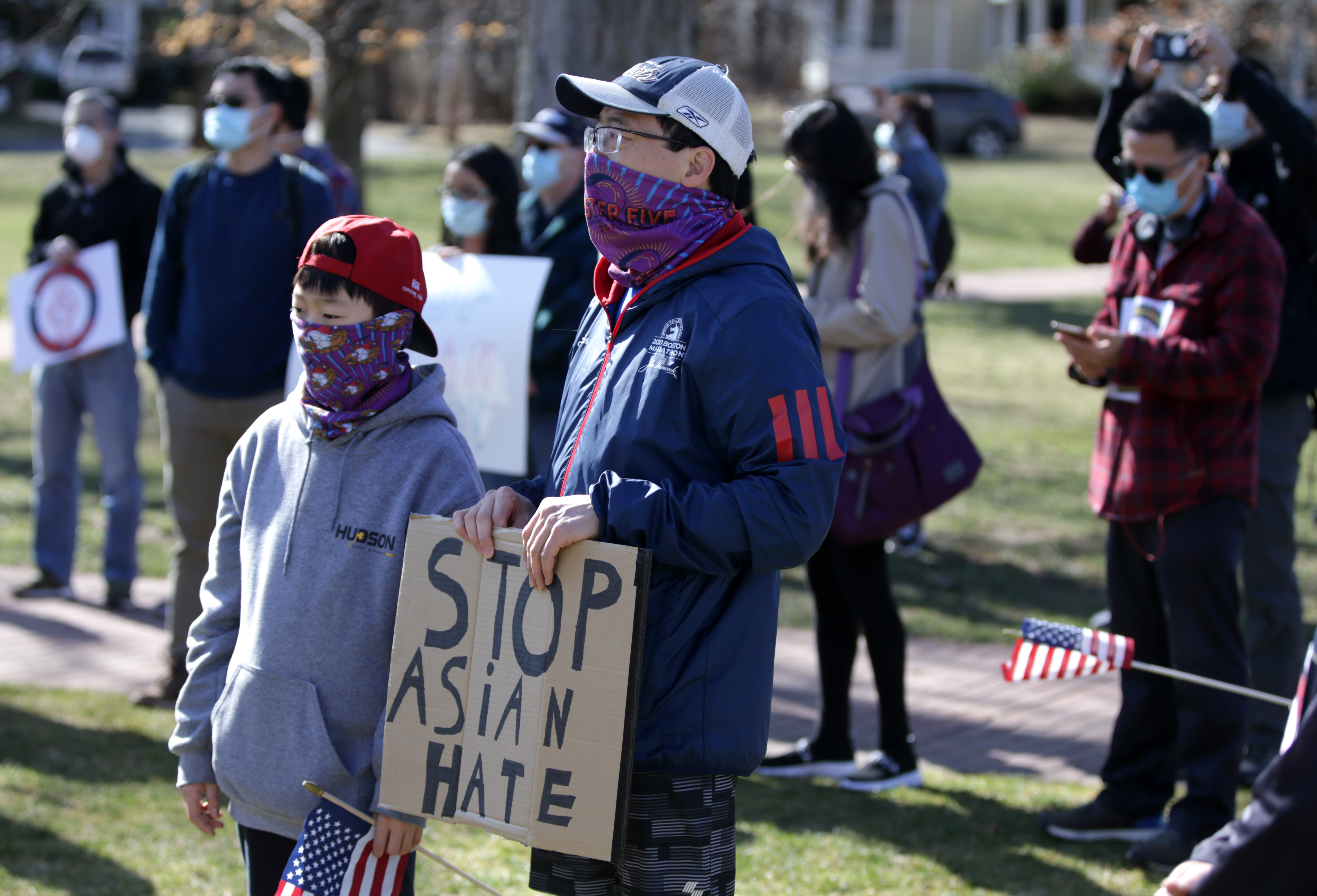 Brandon Ma, left, and his father Weijun Ma, right, were in Hopkinton at the Rally & Run To Stop Asian Hate.