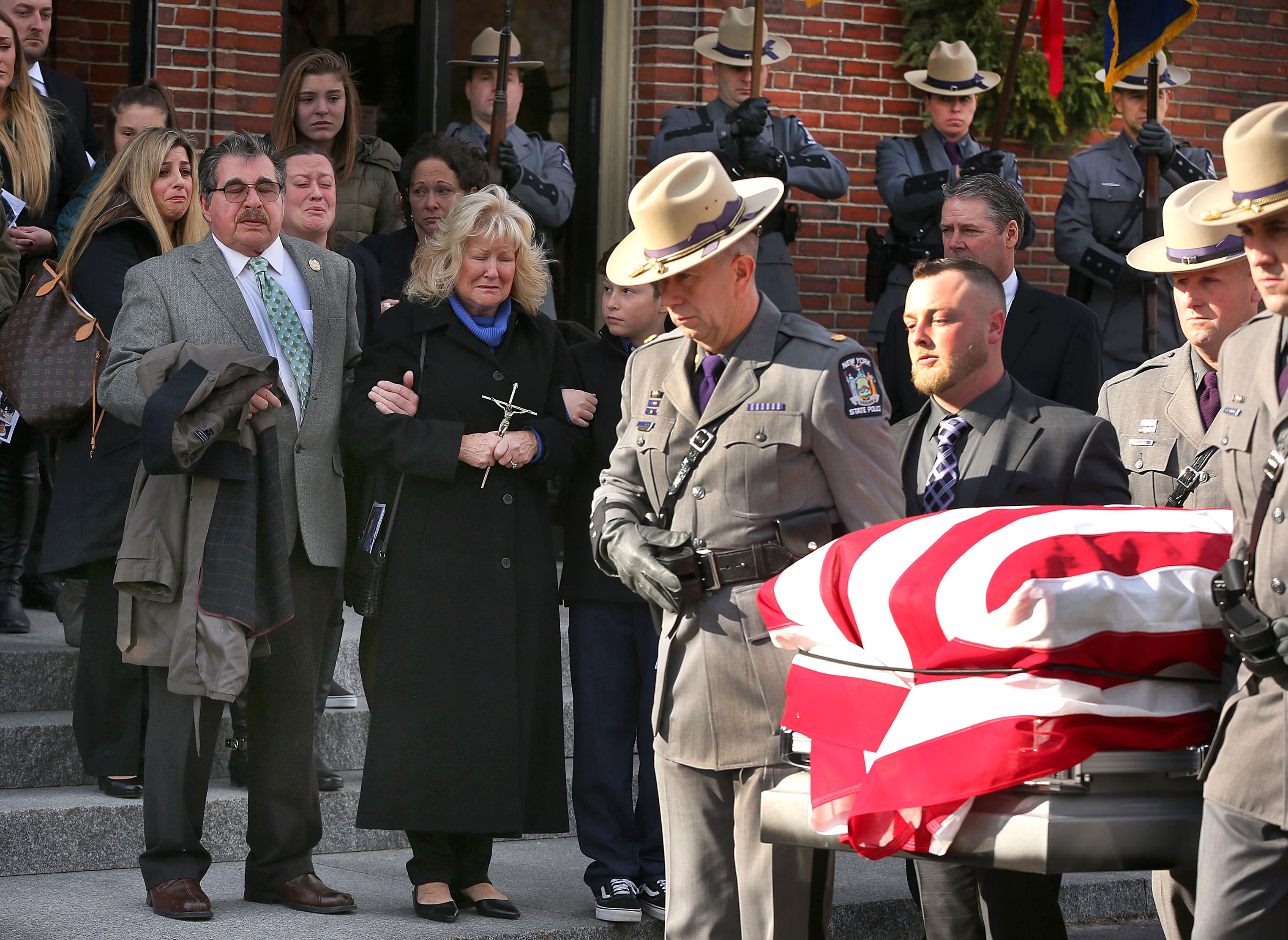 Mourners gatthered on January 8 at a funeral Mass at Saint Margaret’s Church in Burlington for Massachusetts native Ryan Fortini, a New York State trooper who died from cancer related to the toxic dust from the terrorist attack on the World Trade Center in NYC on 9/11.