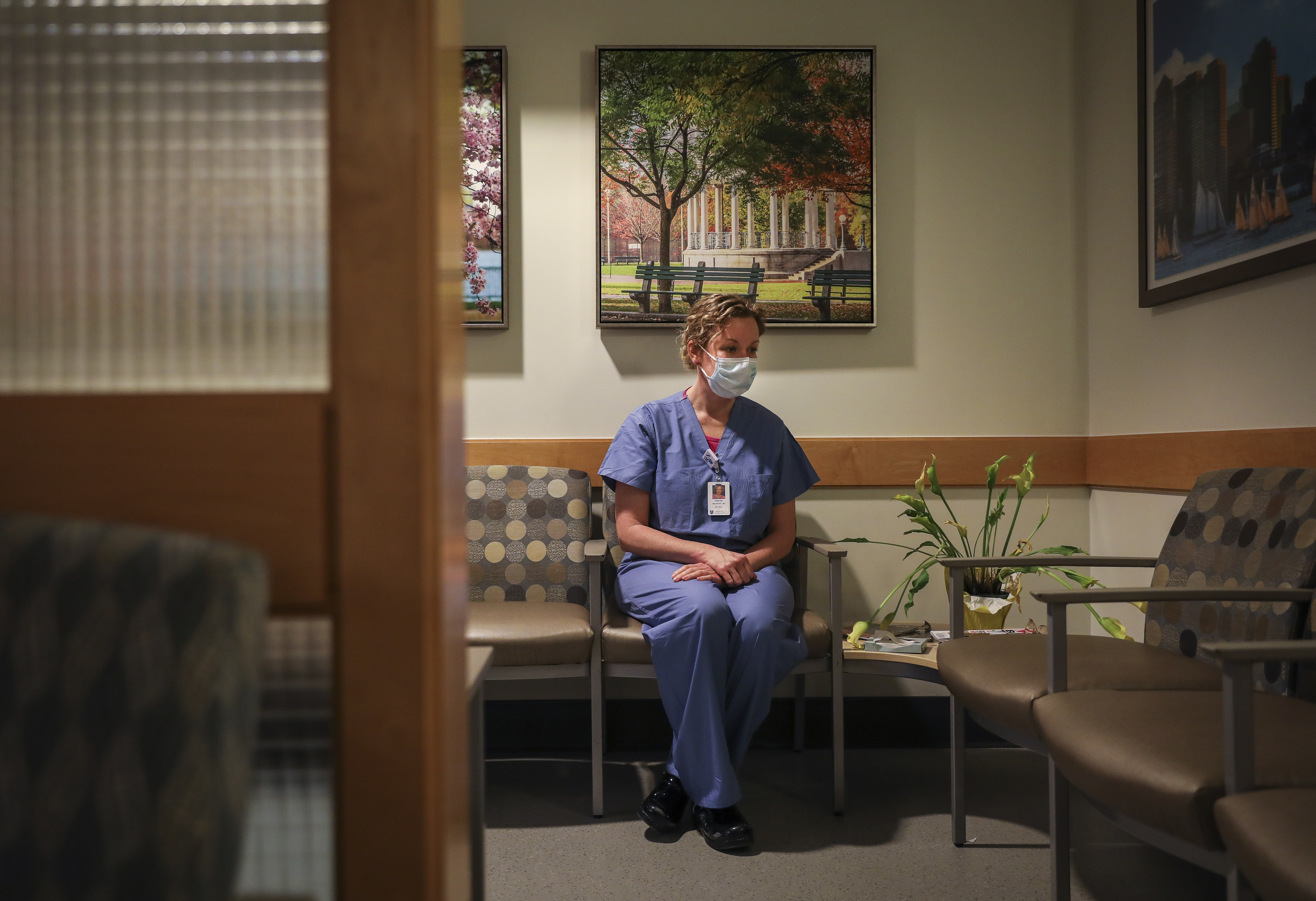 BOSTON - 4/2/2020:  Christine McCarthy sits for a portrait in what is usually a full waiting room in the ICU at Massachusetts General Hospital. McCarthy has worked as a nurse at MGH for over 20 years and has been a palliative nurse for the past year. (Erin Clark/Globe Staff)