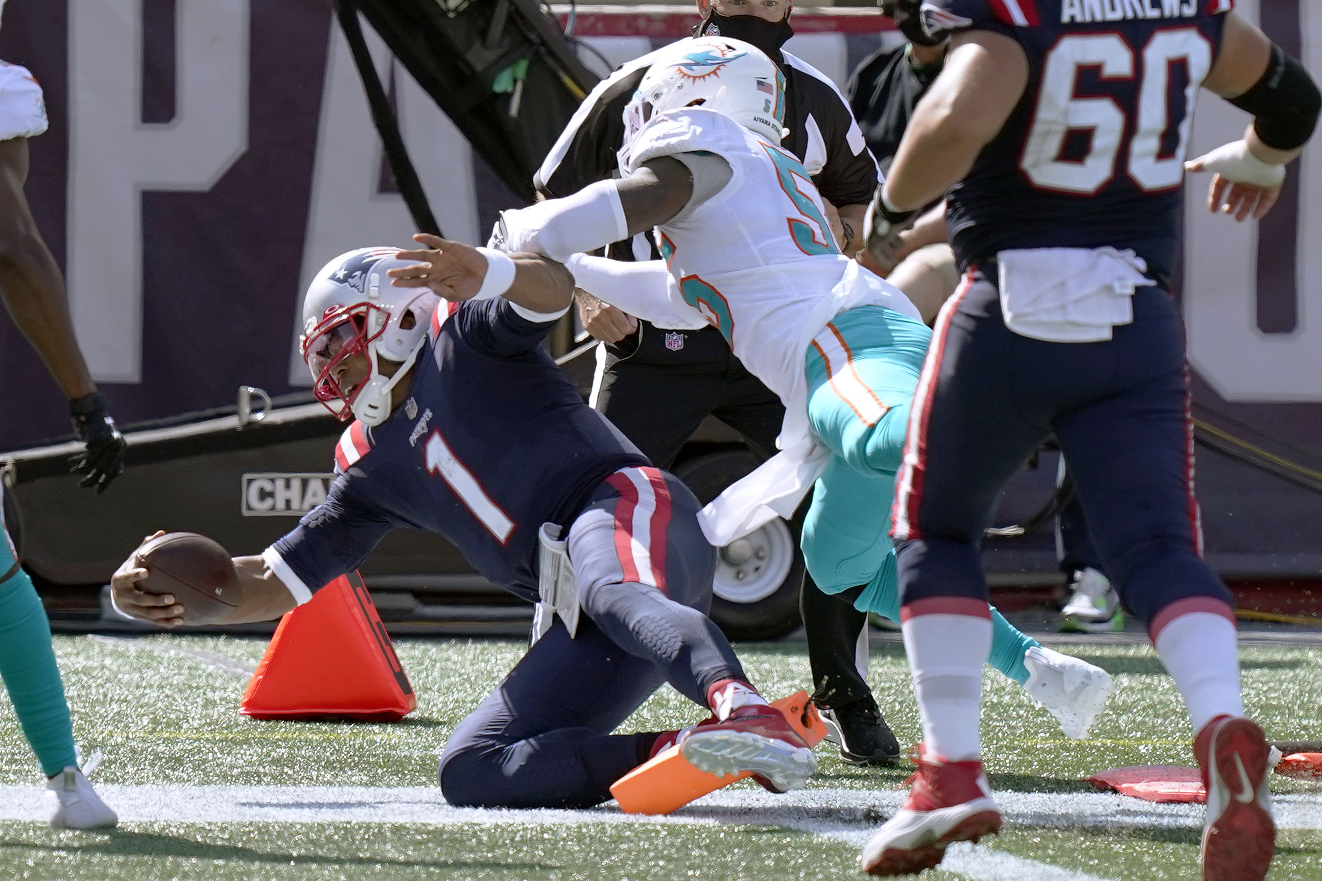 Miami Dolphins hold New England Patriots, Cam Newton in check