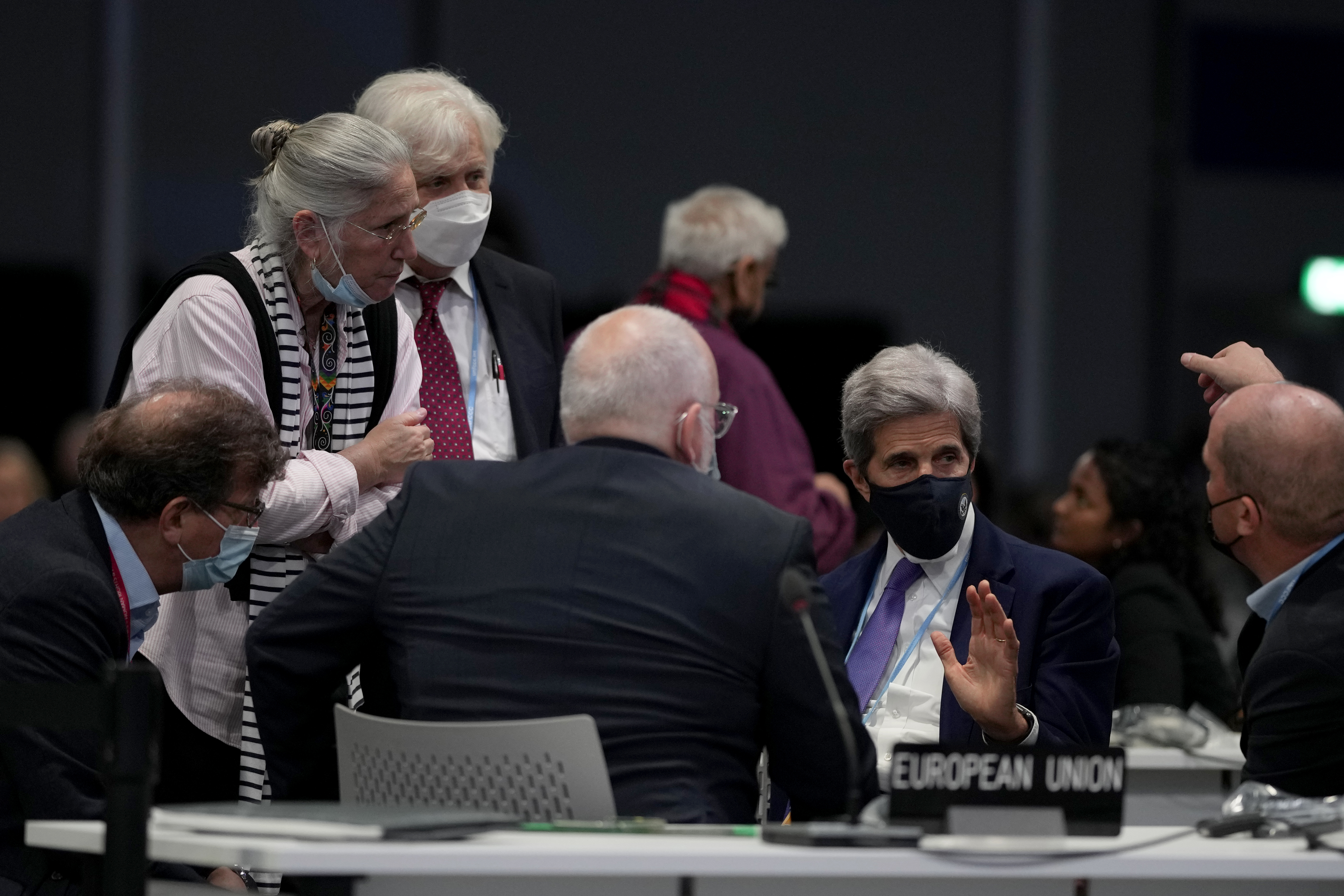 Kerry spoke to delegates including European Commissioner for European Green Deal Frans Timmermans (center) at COP26.