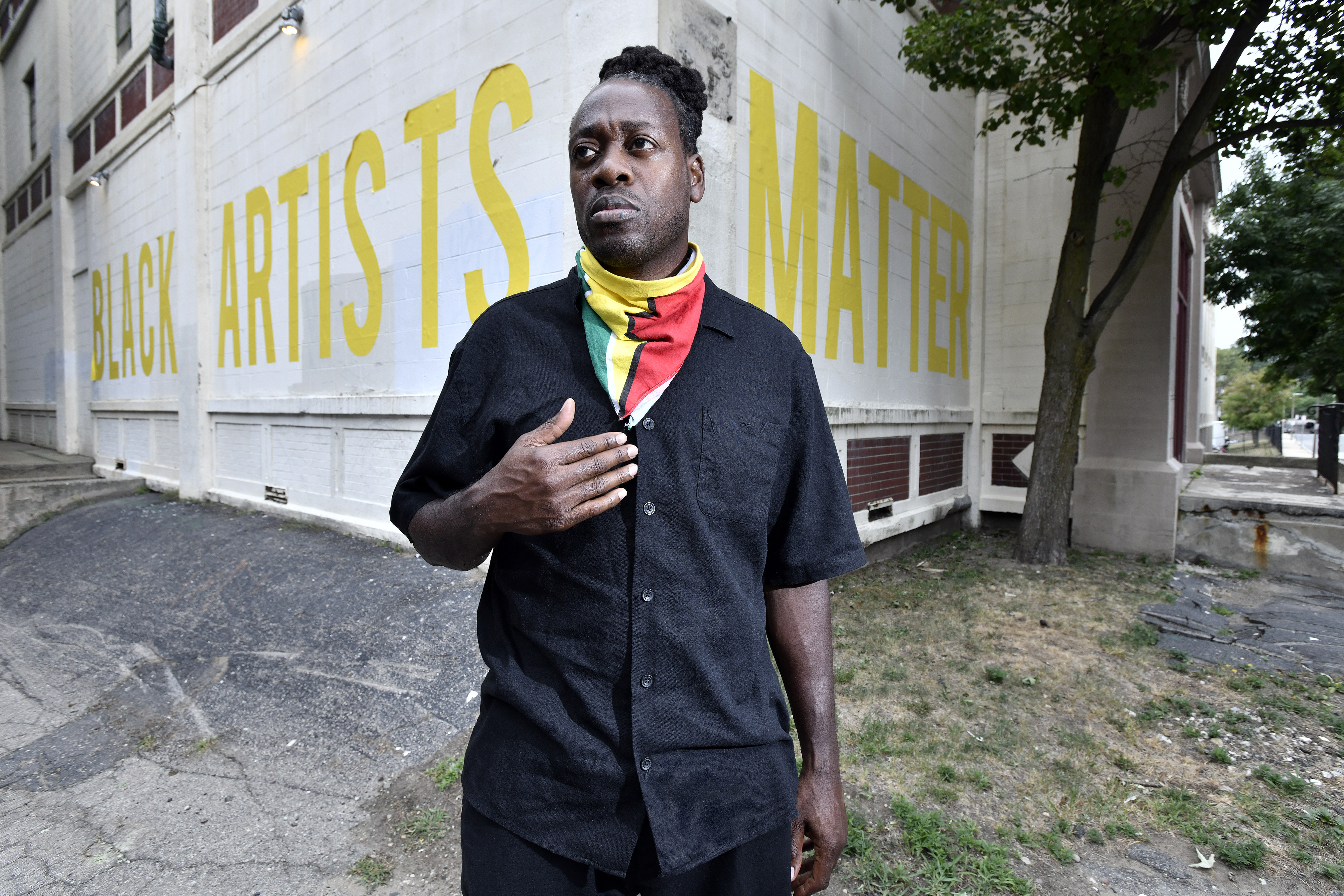 Marlon Forrester stood by the building that houses Northeastern University's African-American Master Artists-in-Residence Program.