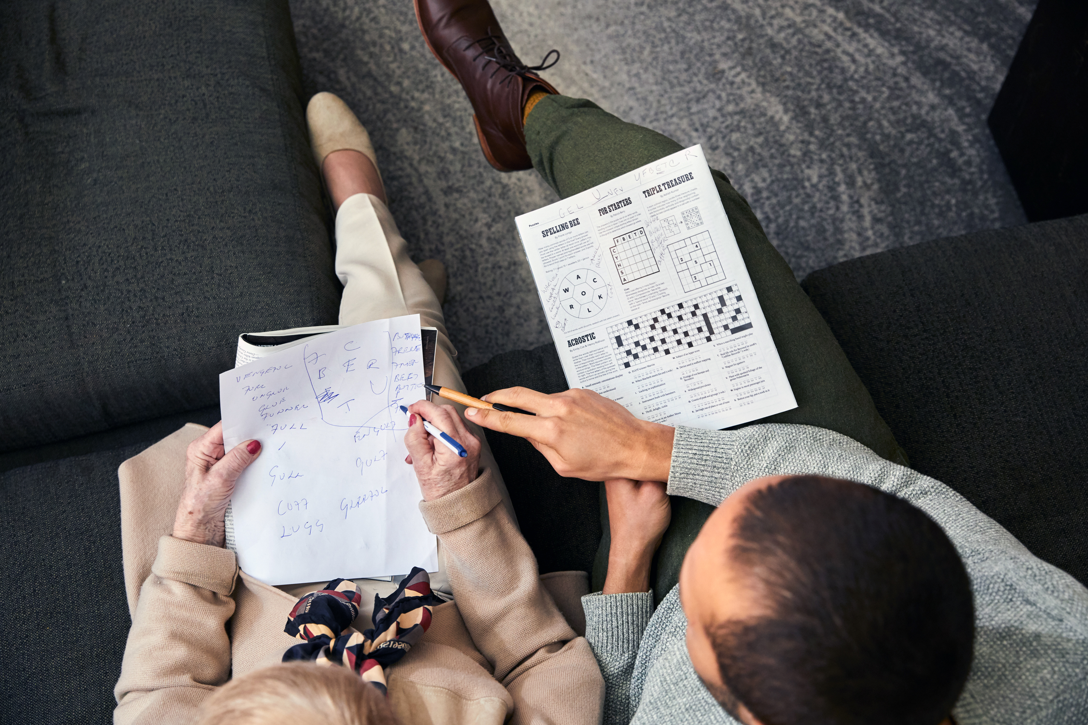 Sian-Pierre Regis and his mother, Rebecca Danigelis, work on a crossword puzzle in his apartment in Manhattan in March 2020.