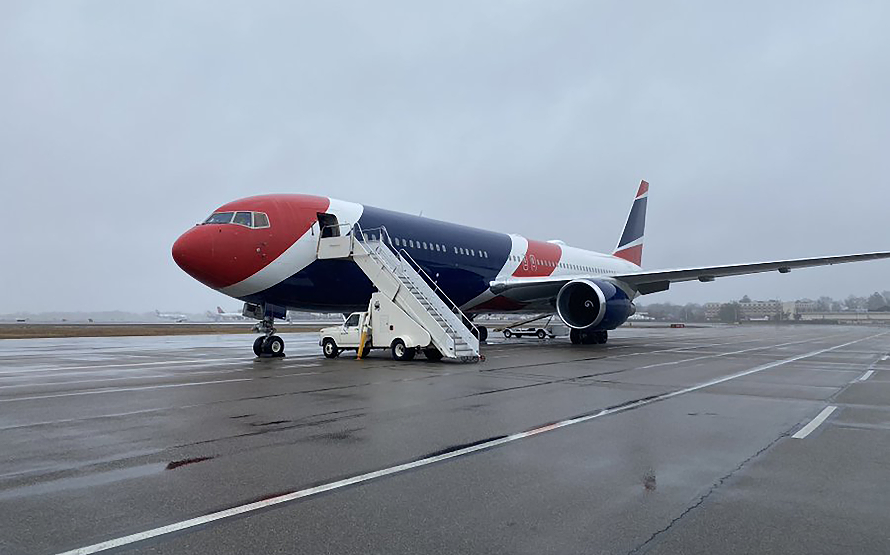 Patriots team plane takes University of Virginia athletes to