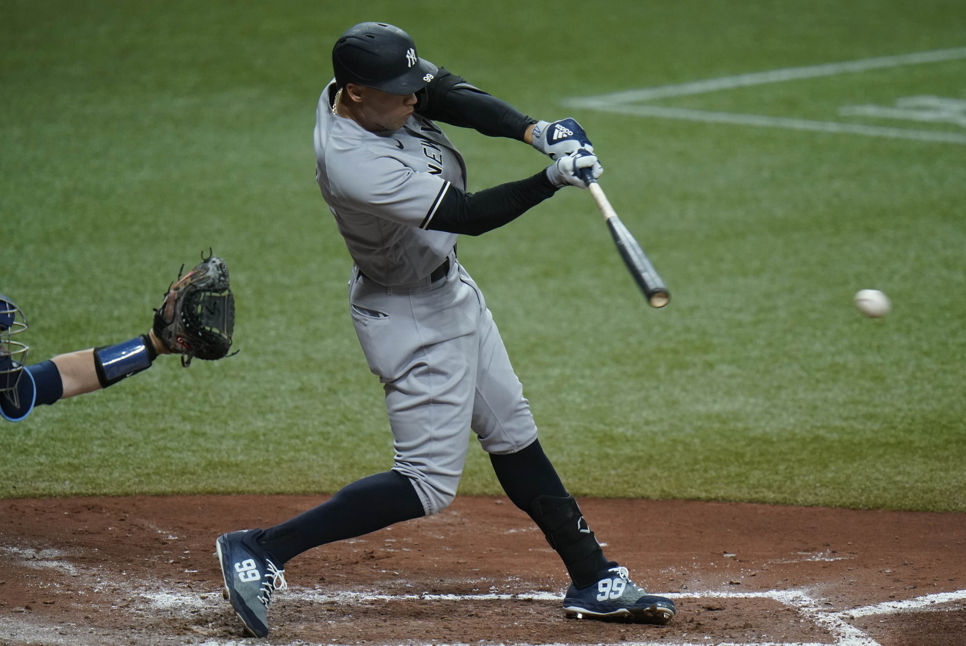 Aaron Judge, seen here delivering a fourth-inning single, had three hits for New York Wednesday.