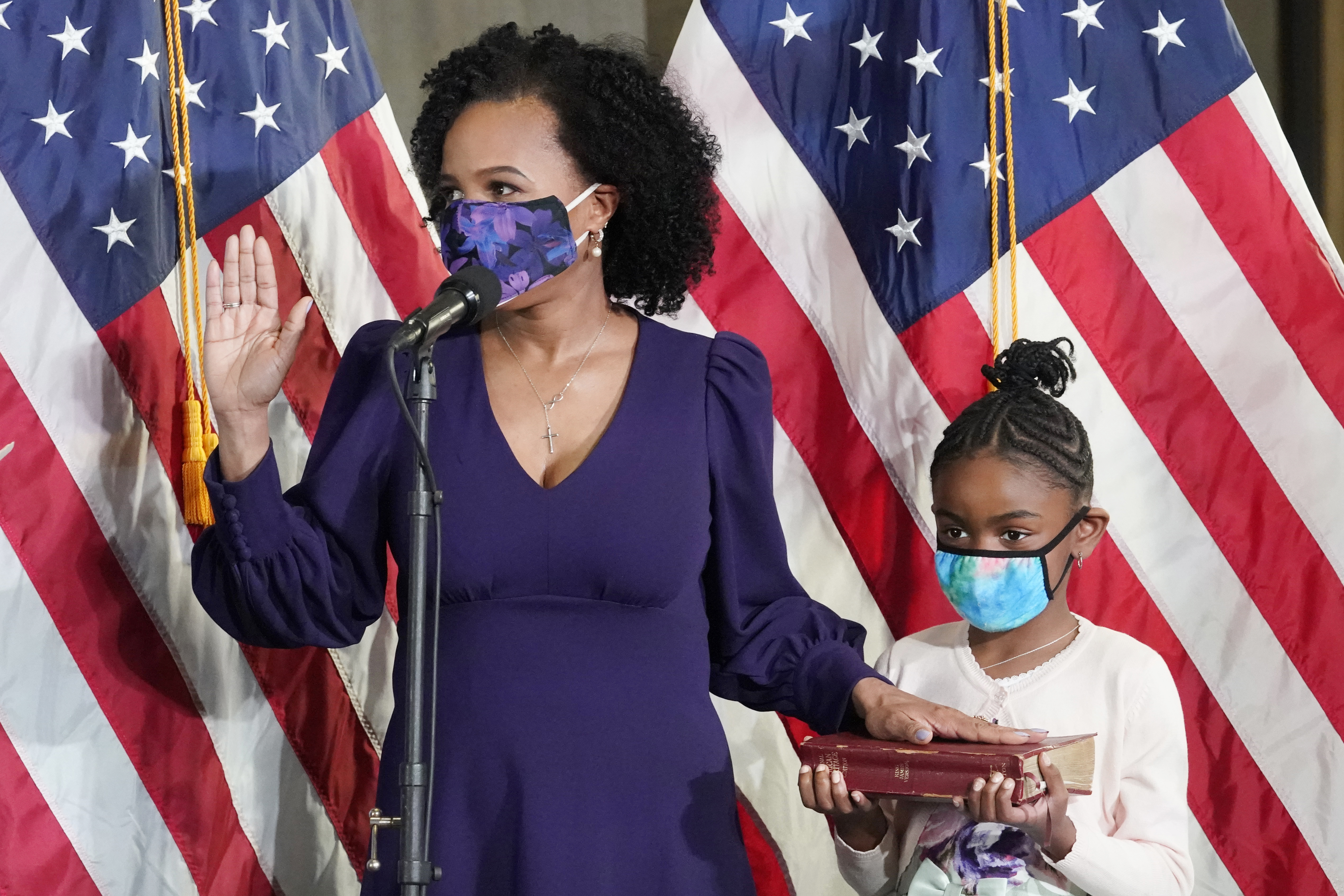 Then-City Council president Kim Janey is sworn in as Boston's new mayor at City Hall while her granddaughter, Rosie, holds a Bible, on March 24, 2021.