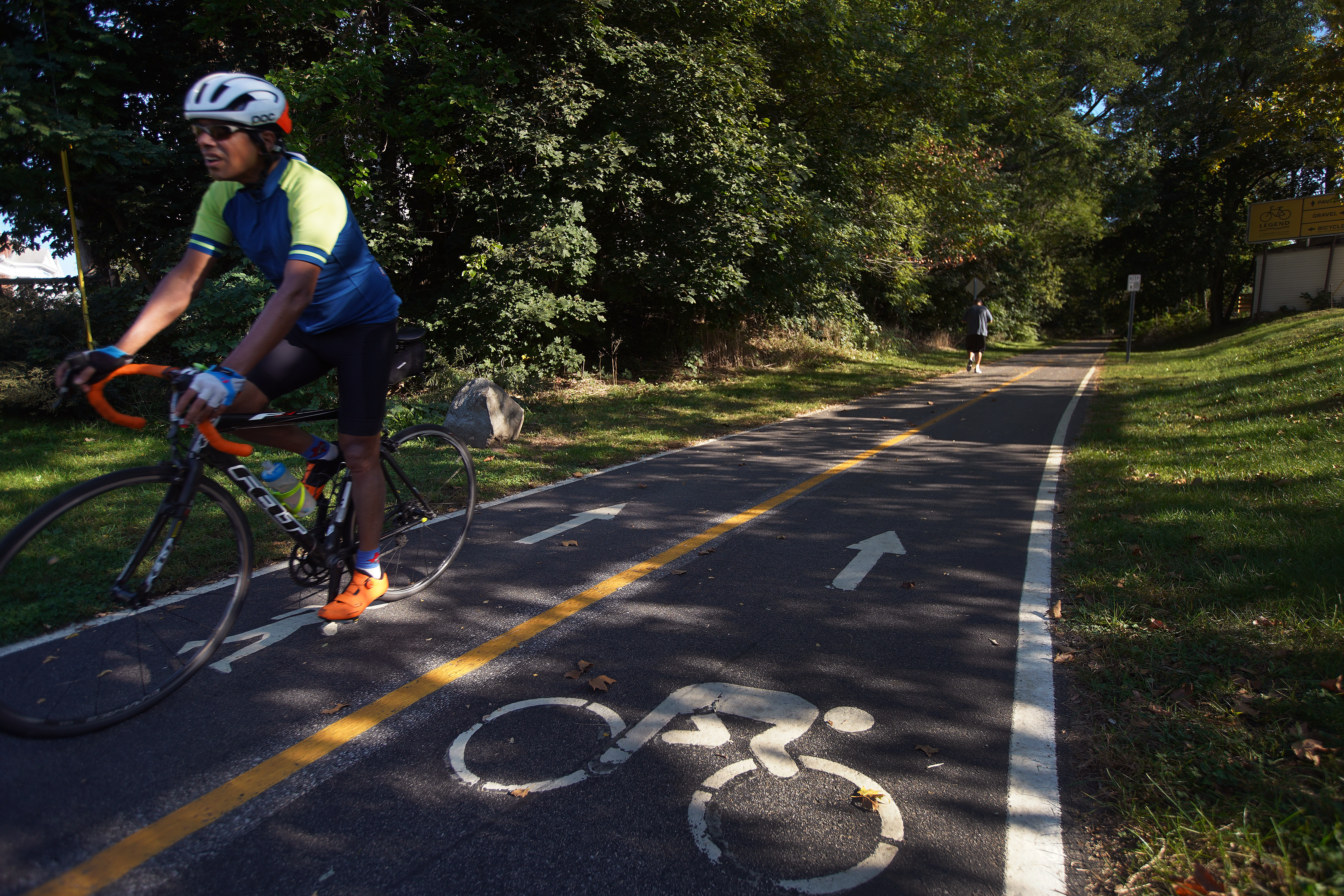 A cyclist on the East Bay Bike Path at Riverside Square in East Providence.