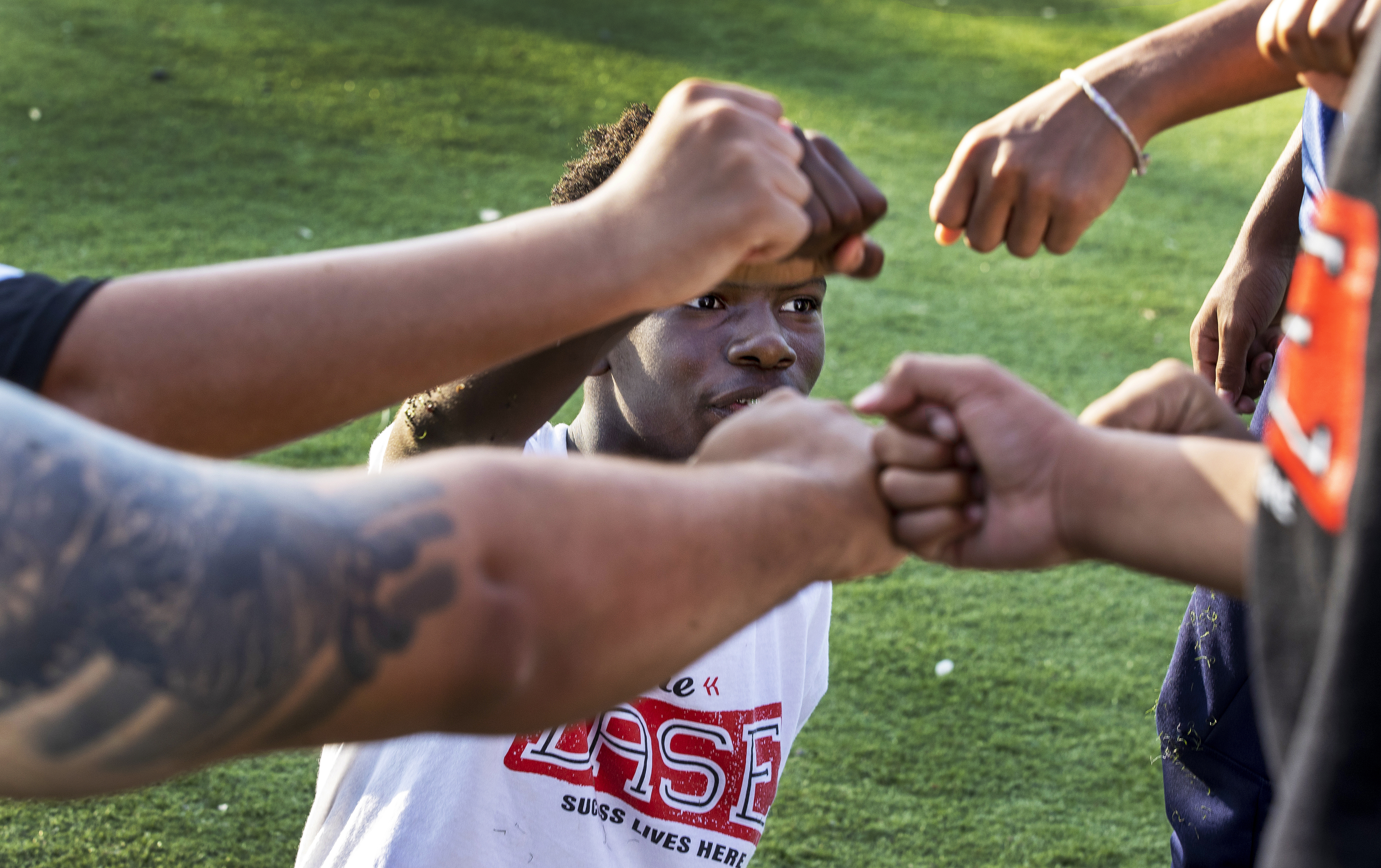 Quincy Johnson fist bumped teammates after the BASE Astros practice at Madison Park High School.