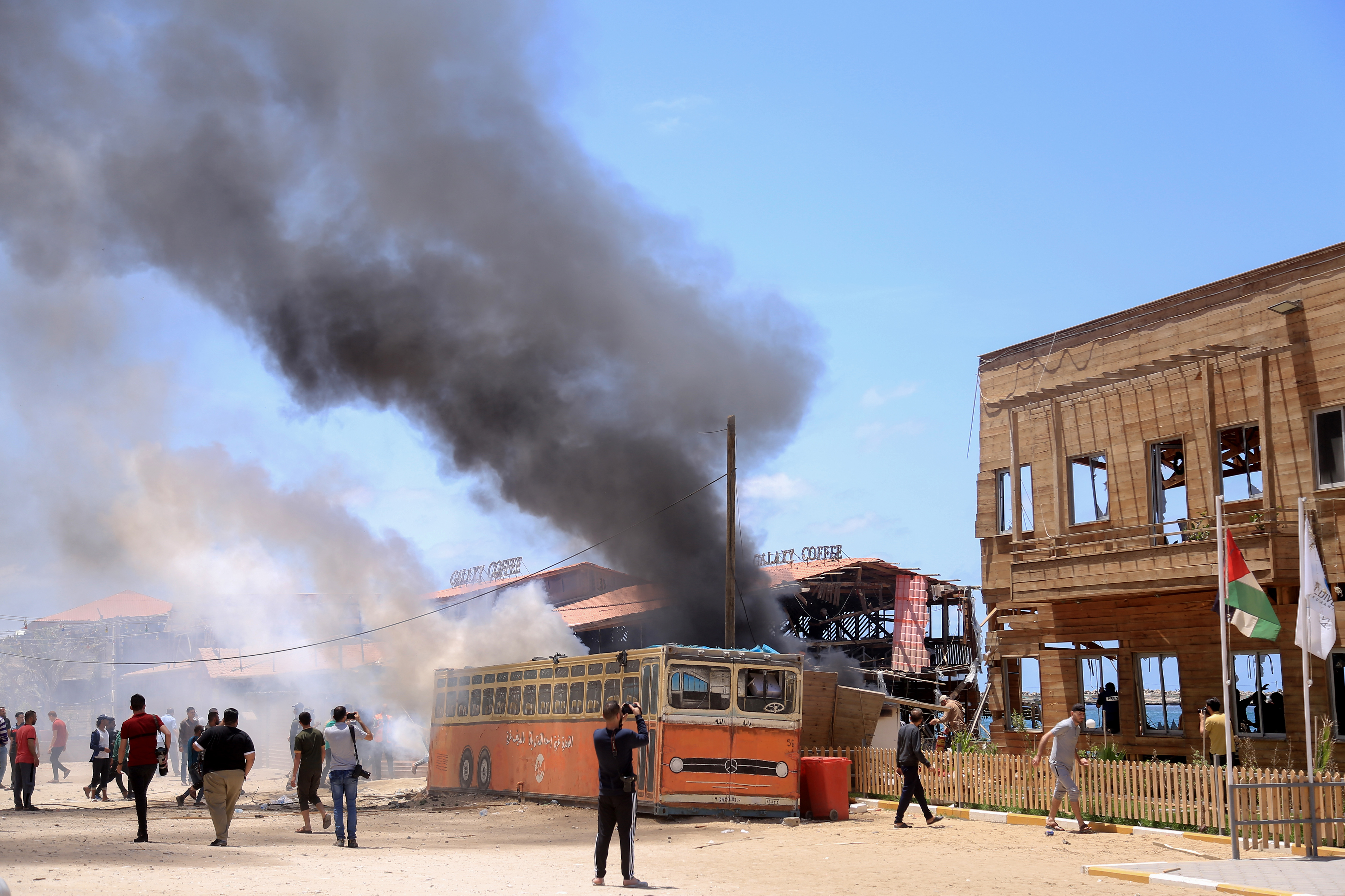 A fire burned at a coffee shop along the beachfront in Gaza City.