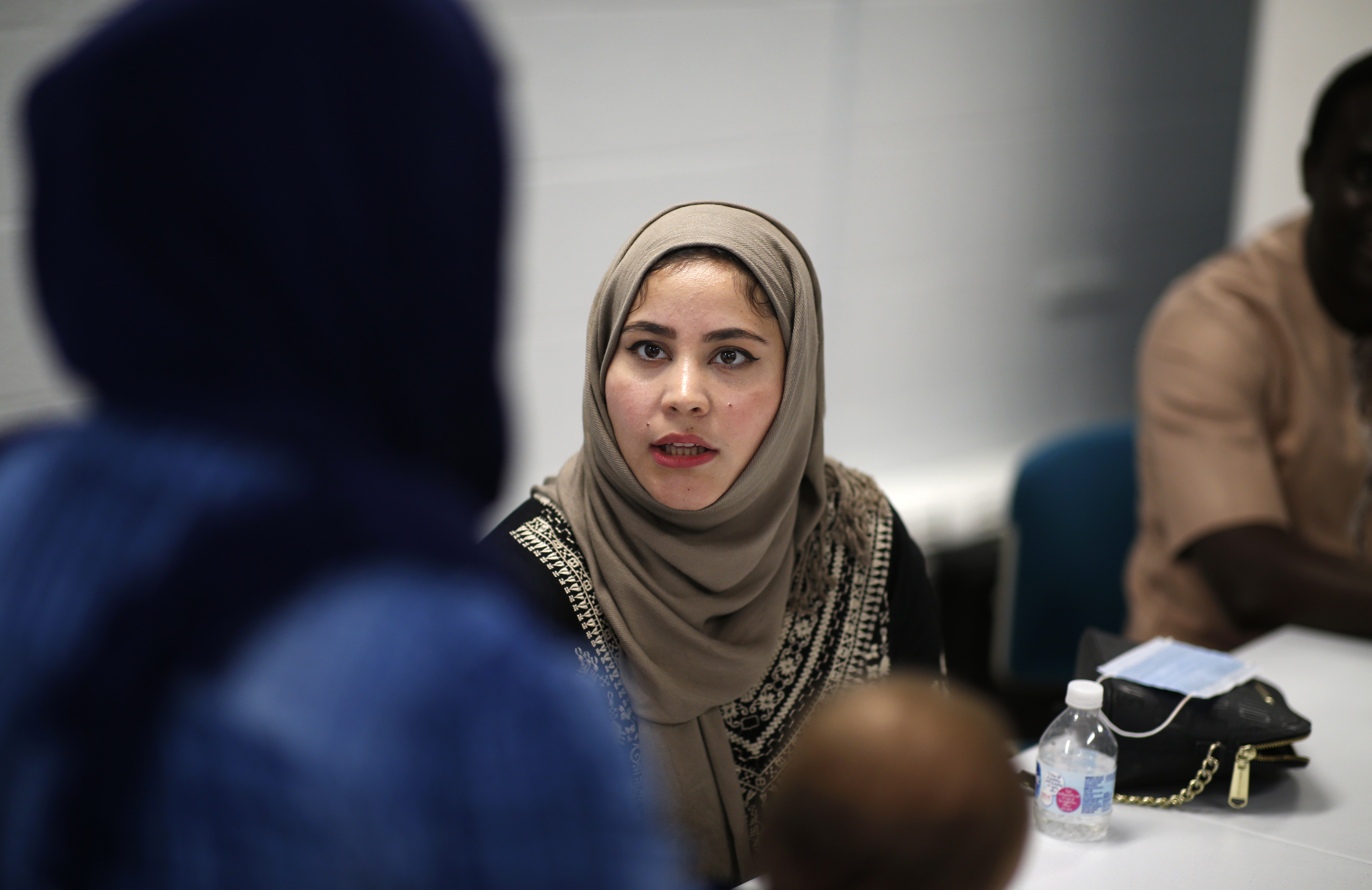 Negina Sadat, who moved from Afghanistan to Rhode Island nearly six years ago, speaks during a meeting at the Refugee Dream Center in Providence.