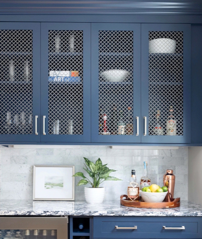 Mesh inserts in the upper cabinets in a kitchen makeover.