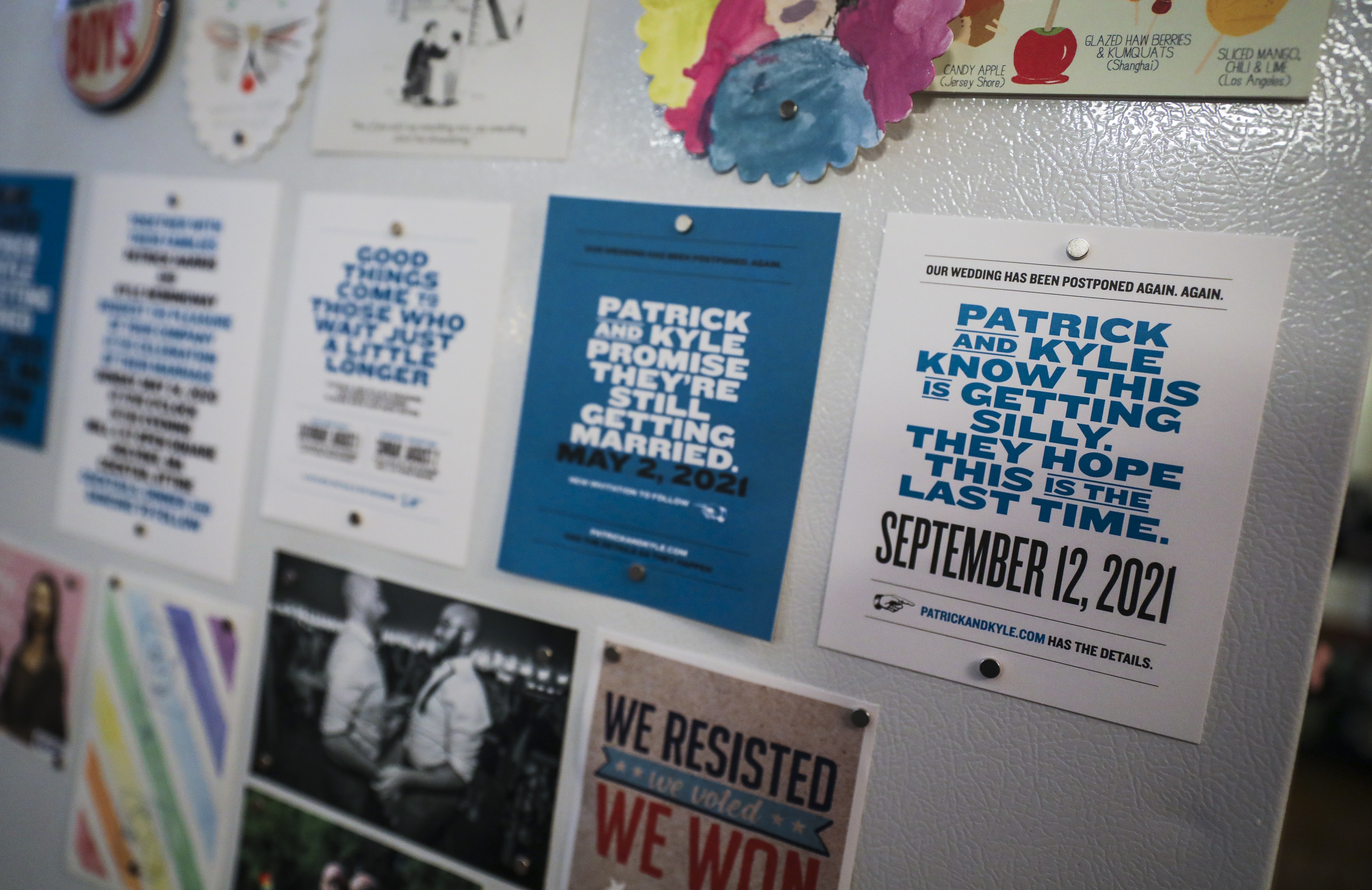 Wedding invitations were displayed on the refrigerator of Kyle Hemingway and Patrick Harris in their Savin Hill apartment.
