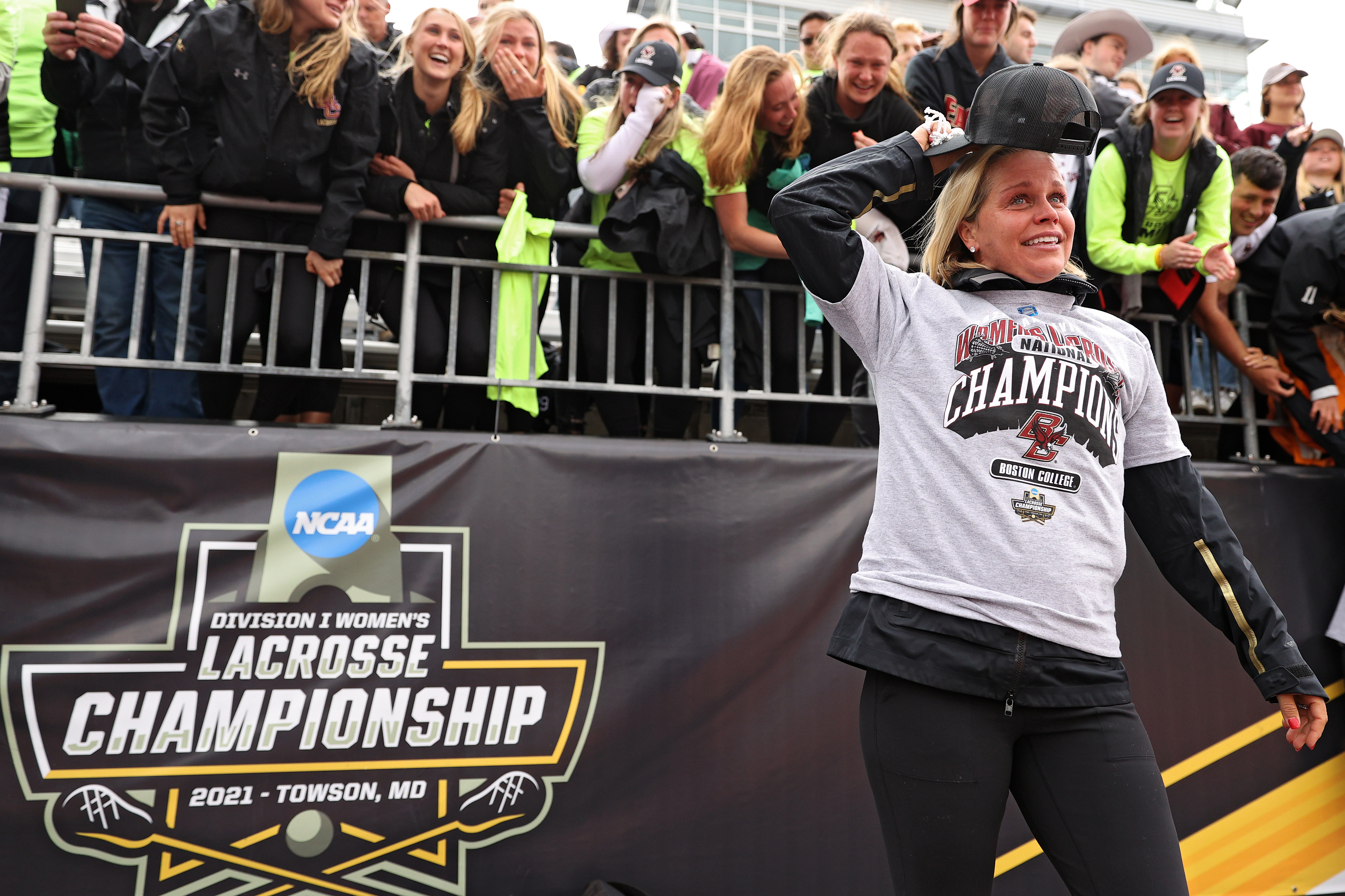 Boston College coach Acacia Walker-Weinstein celebrates in front of fans following Sunday's victory.