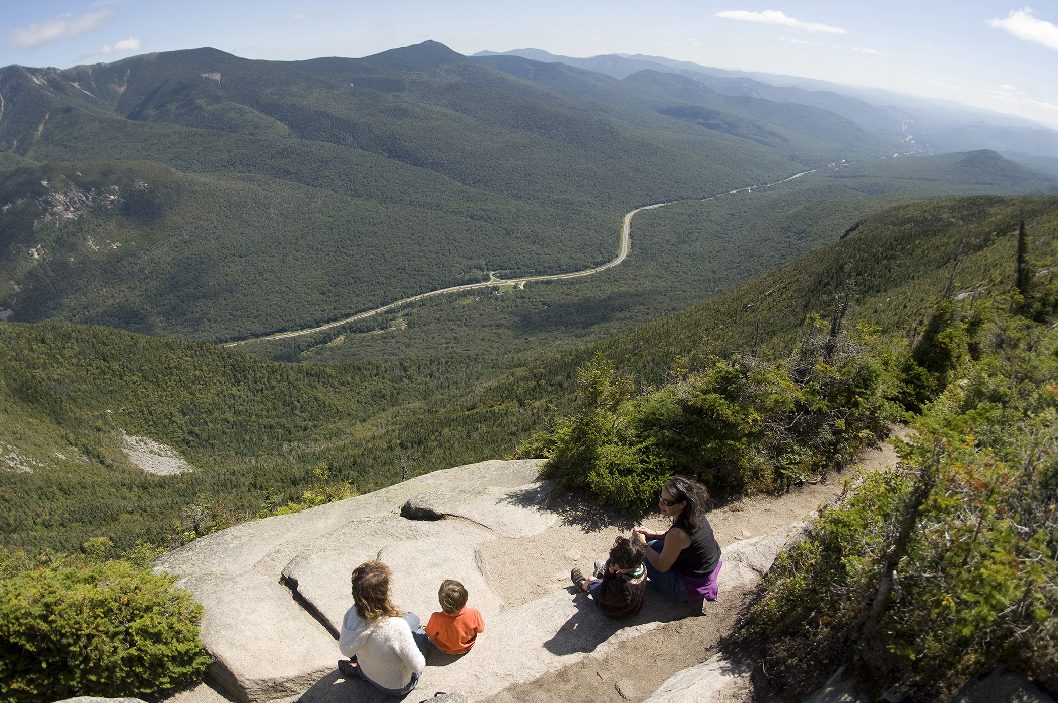 The Rim Trail on the summit of Cannon Mountain lends a great view of Franconia Notch State Park and the Parkway. Lafayette Campground is directly off the parkway in the center of the photo (grassy area).