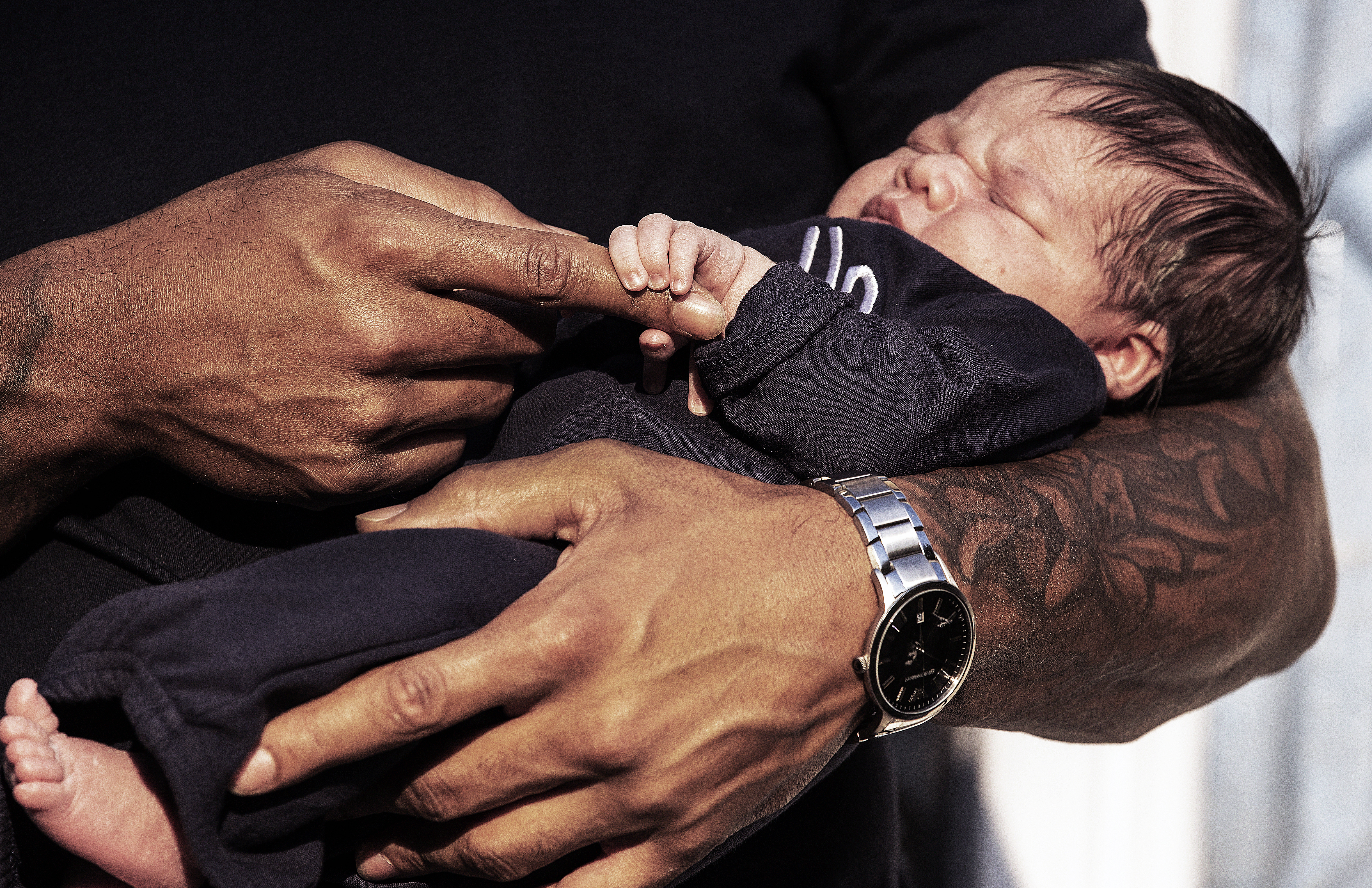 Dont'a Hightower held his new son Grayson.
