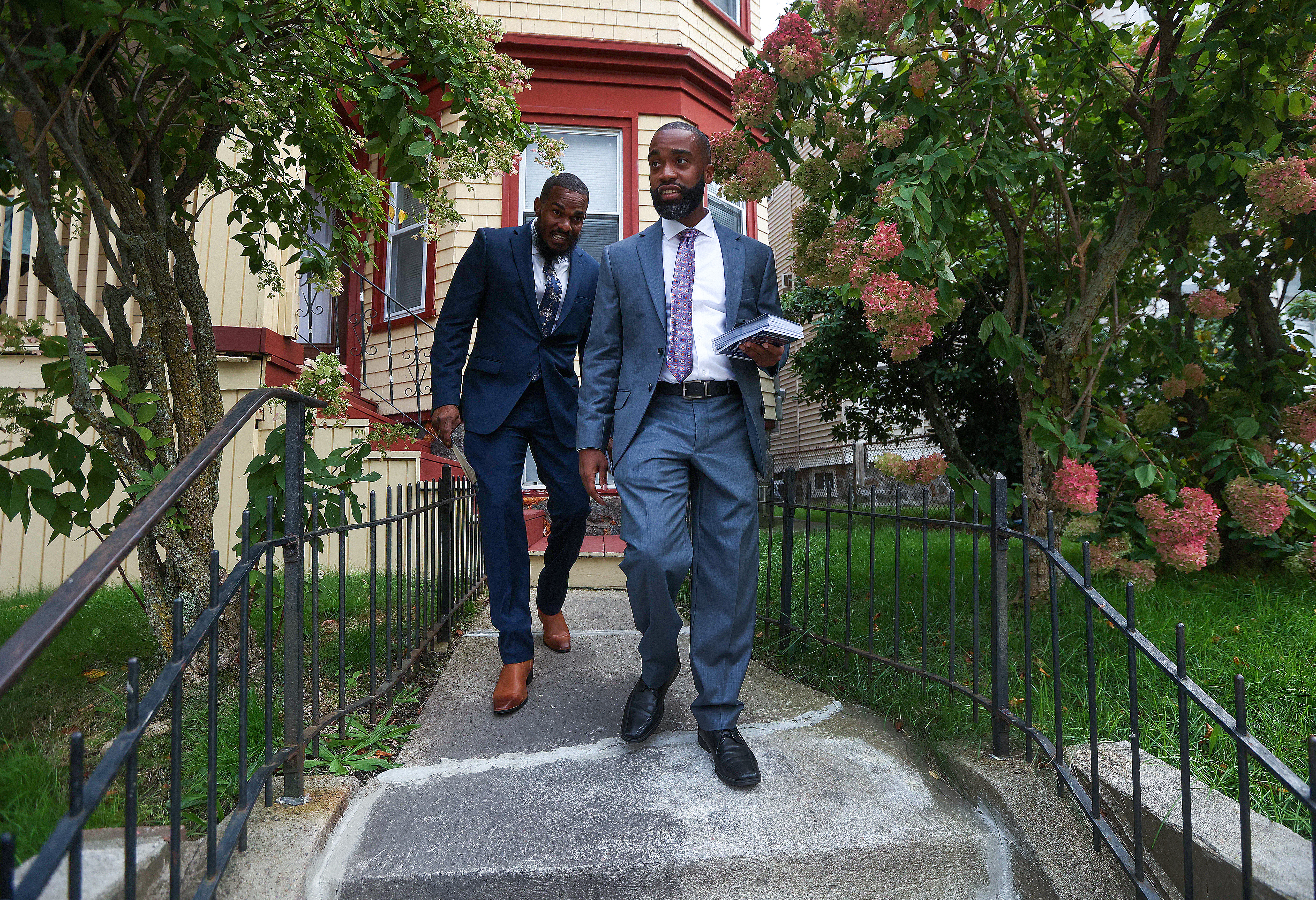 Brian Worrell, followed by campaign aide Chet Brown, knocked on doors in Dorchester.