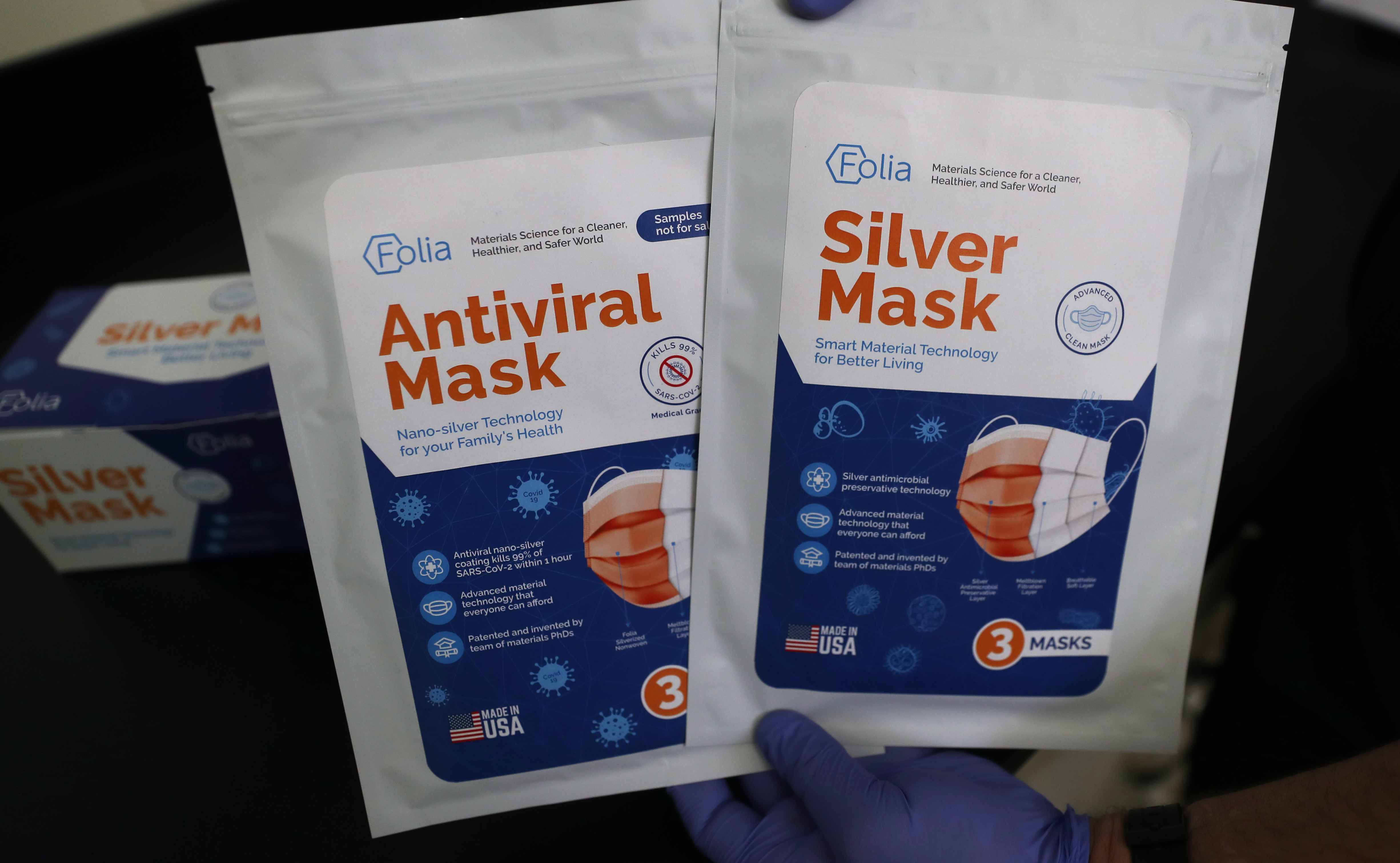 Folia's international antiviral mask packaging (left) and its US "silver mask" packaging.