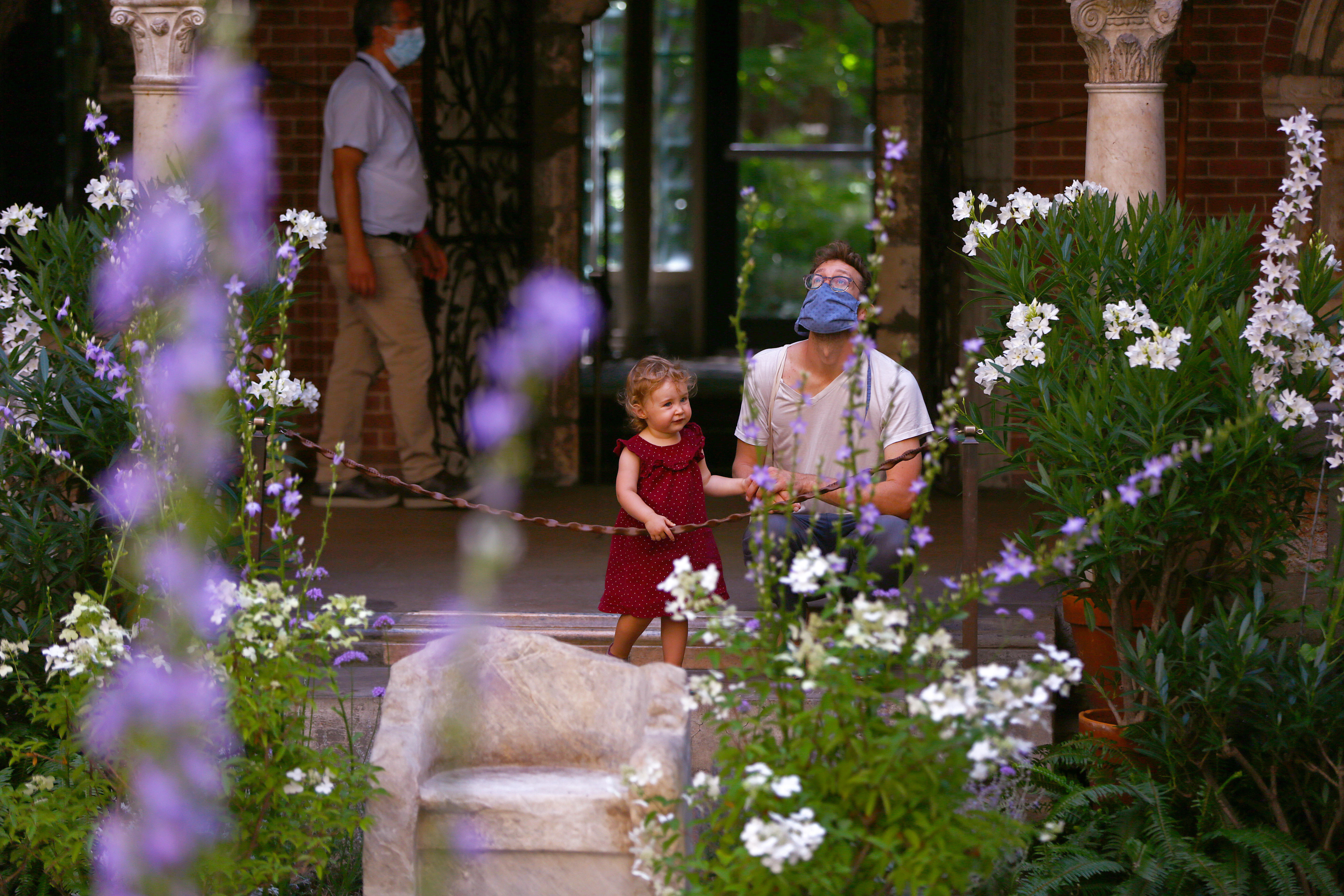 A man and young girl took in the courtyard of the Isabella Stewart Gardner Museum.
