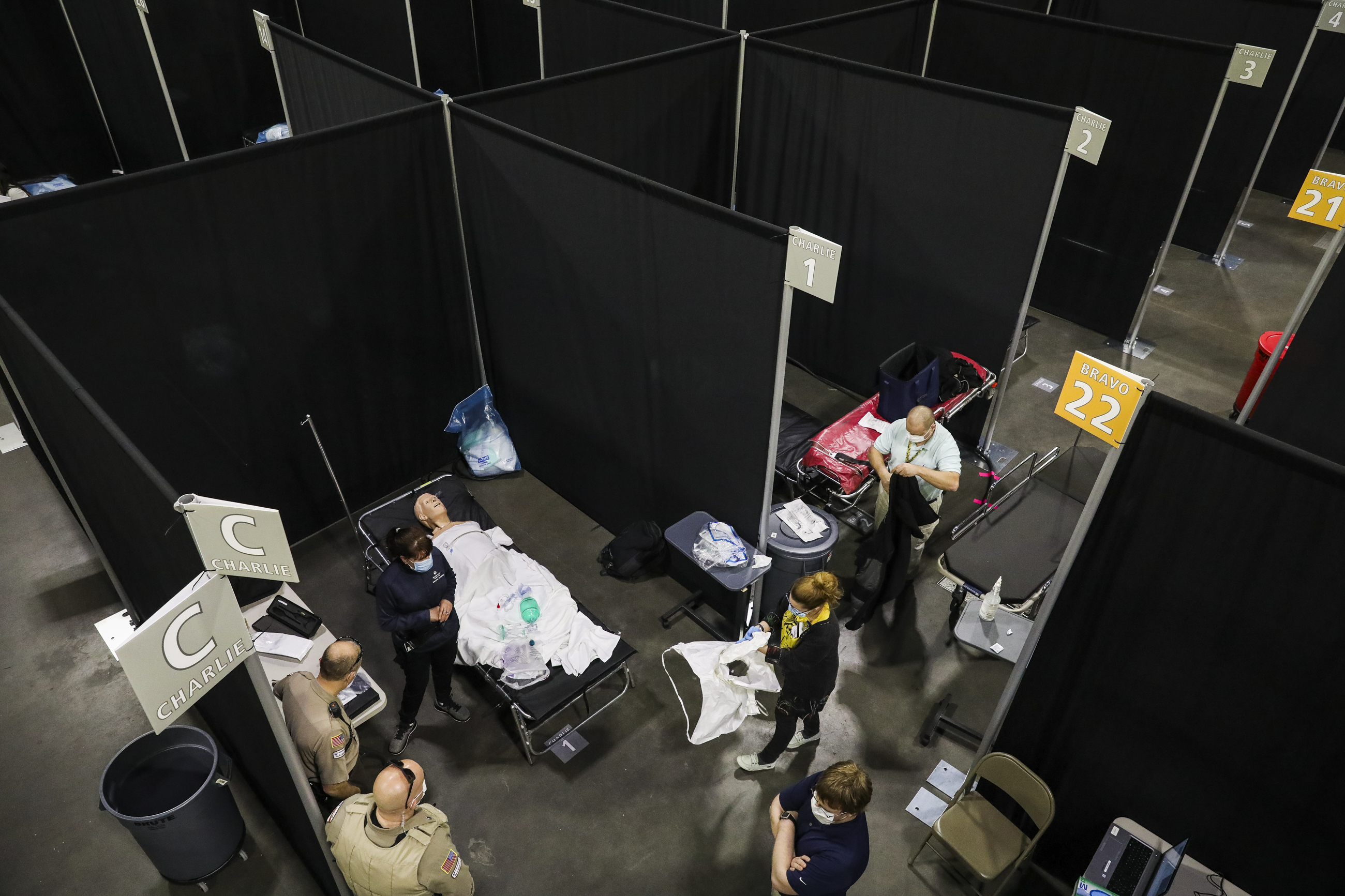 WORCESTER - 4/7/2020:   A simulation is set up in a makeshift hospital room to properly train paramedics as UMass Memorial Health helps to prepare the first field hospital in the state of Massachusetts.  The field hospital has been built at the DCU Center in downtown Worcester as the state prepares for an expected surge in coronavirus patients. UMass Memorial Health Care will operate the pop-up hospital, which is the first one of three that the state is planning to open. The facility is expected to open Thursday, April 9. (Erin Clark/Globe Staff)