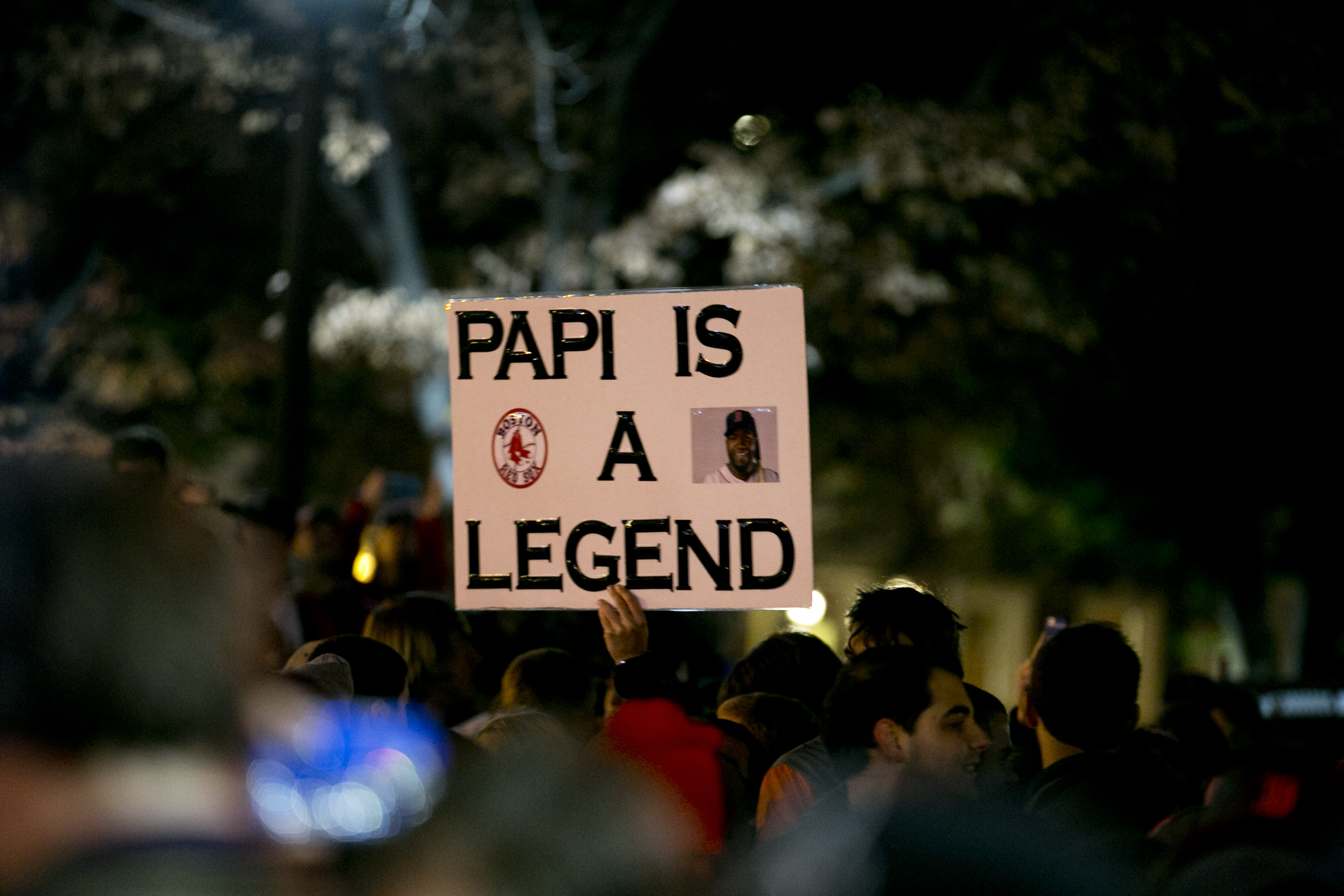 A fan brought a "Papi is a legend" sign to celebrate outside Fenway Park after the Red Sox won the World Series on Oct. 30.