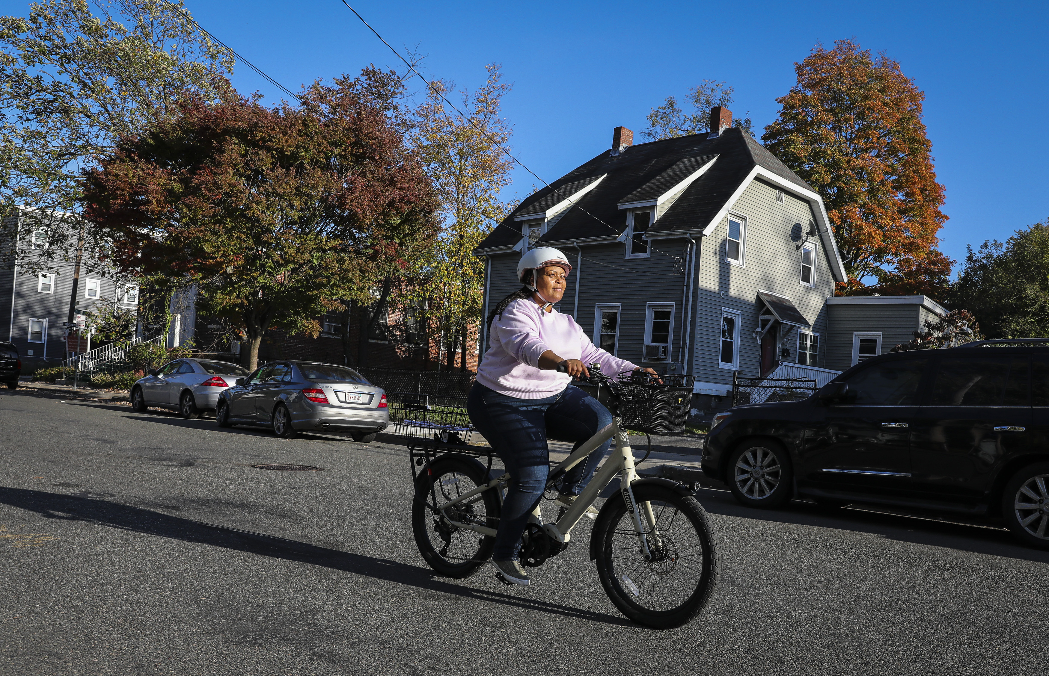 Tiffany Cogell rode her e-bike around her Boston neighborhood on Thursday evening.