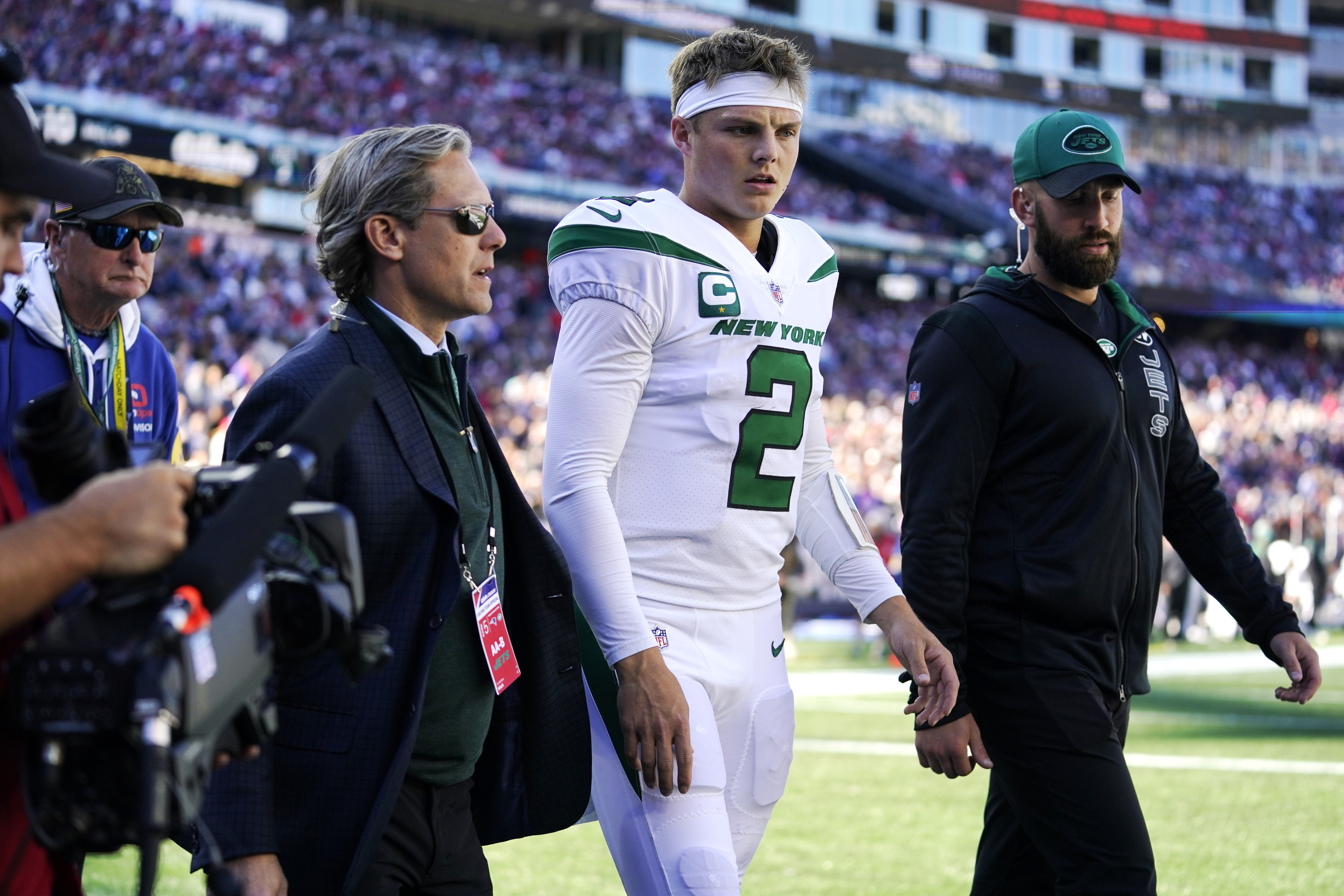 Jets quarterback Zach Wilson headed for the locker room after an apparent injury in the first half.