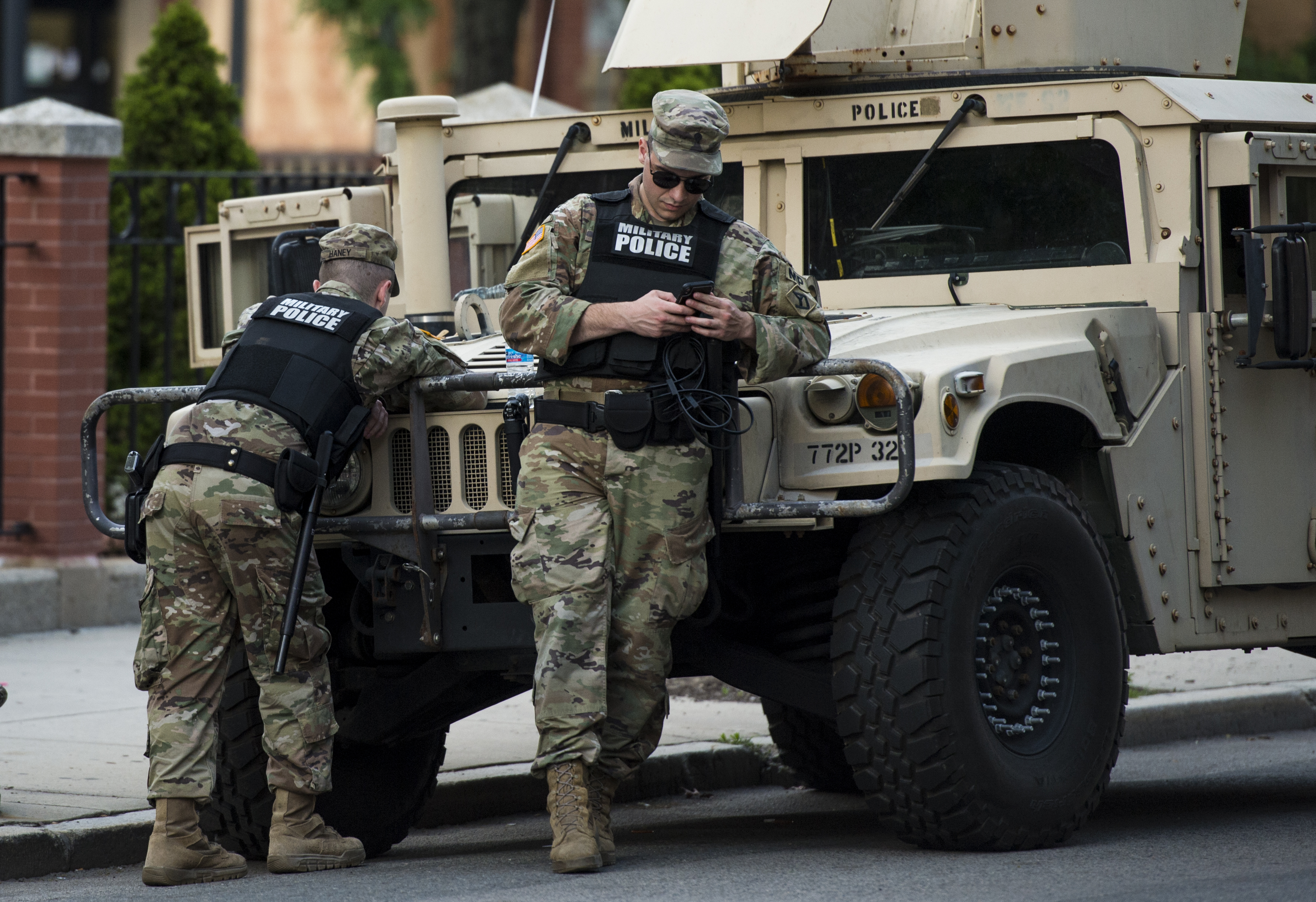 Members of the National Guard leaned against a Humvee on Newbury Street.