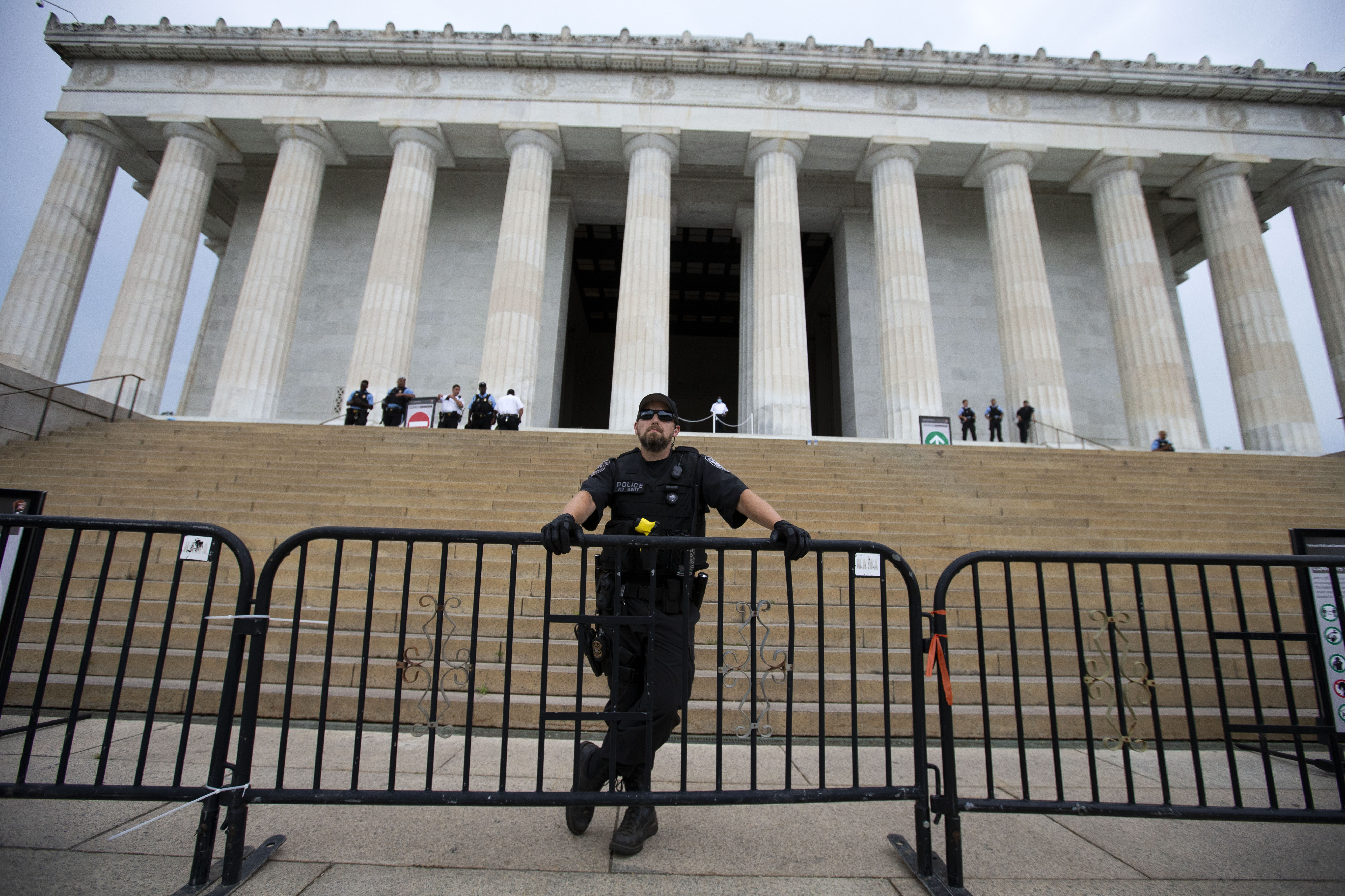 An officer scanned the area as demonstrators rallied at the Lincoln Memorial Thursday.