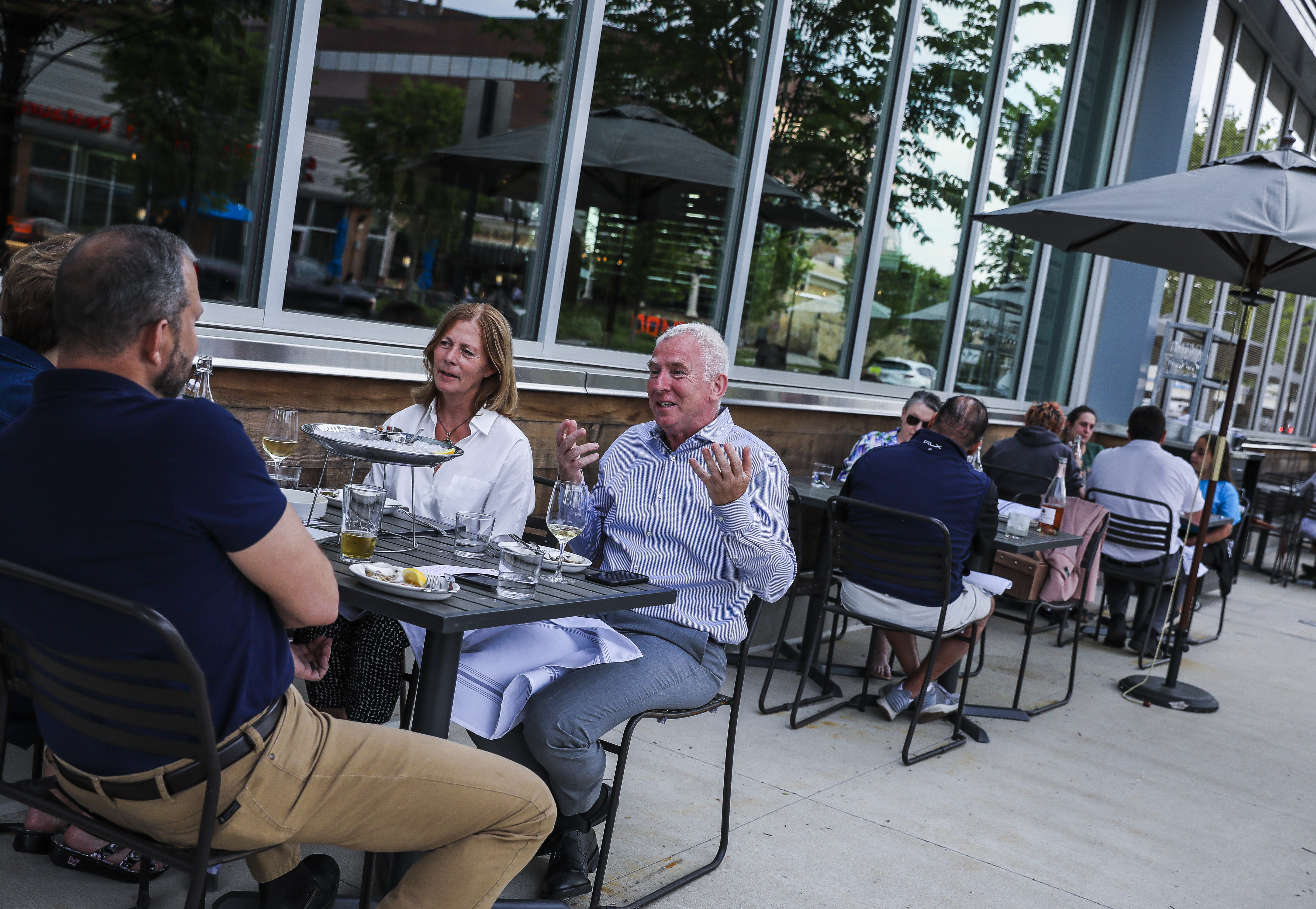 Guests enjoy dinner on the patio of Row 34 in Burlington.