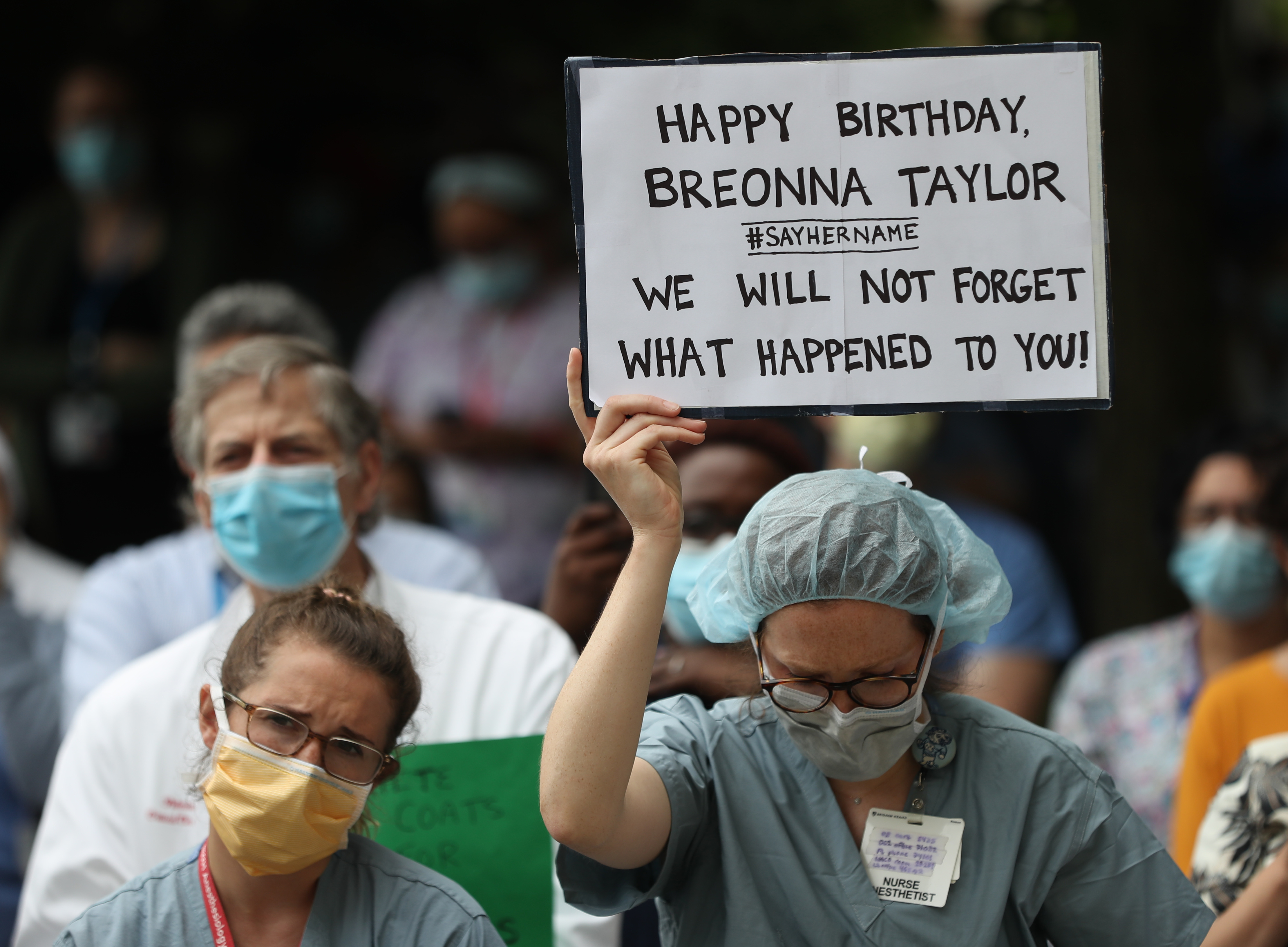 A sign held up in remembrance for Breonna Taylor on the lawn at the Brigham and Women's Hospital.