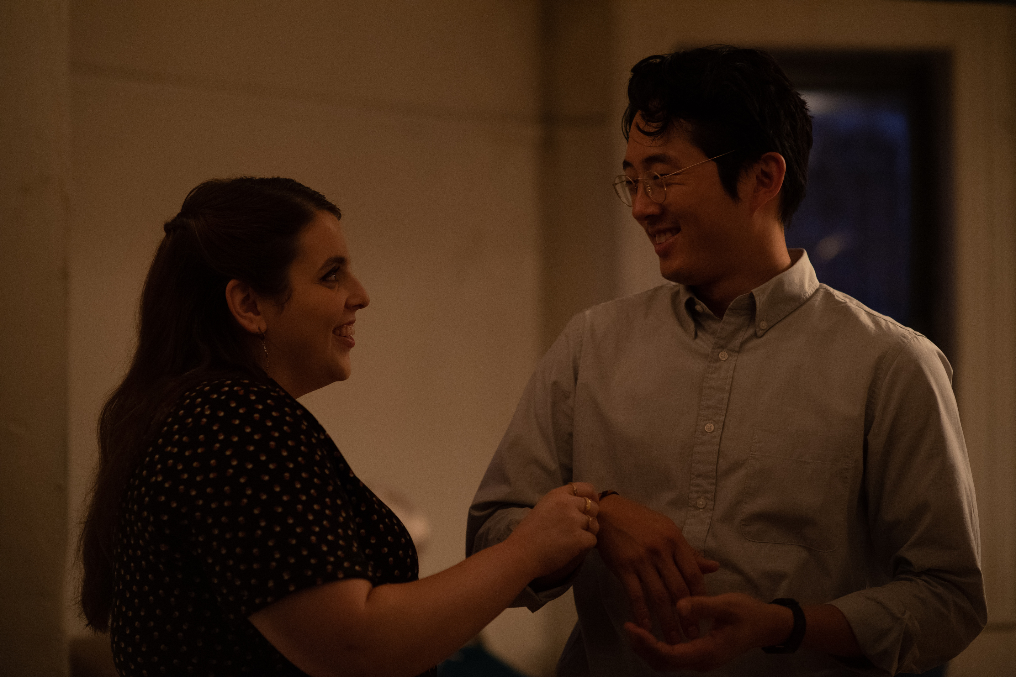 Beanie Feldstein and Steven Yeun in "The Humans."