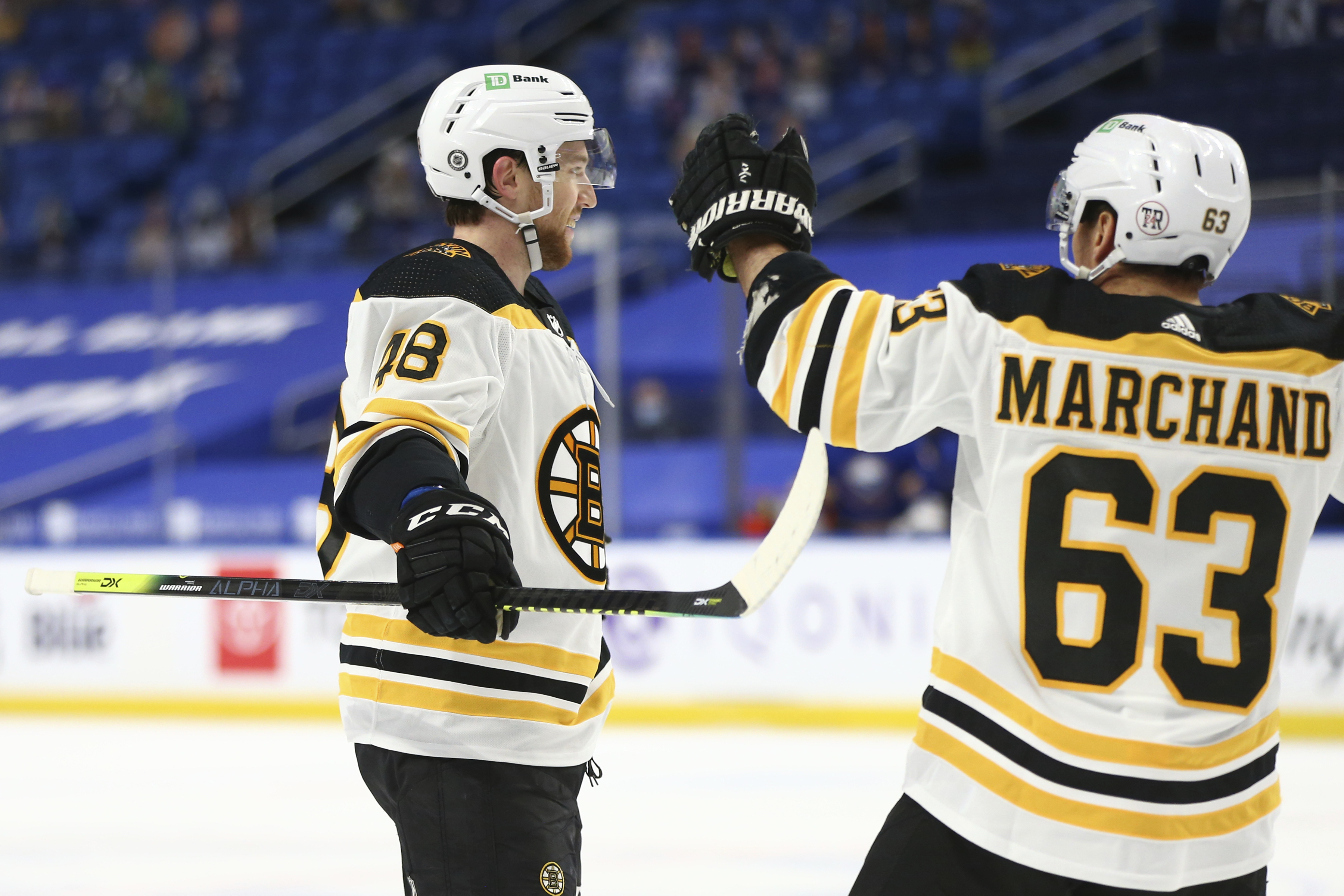 Brad Marchand comes to congratulate Matt Grzelcyk on his fourth goal of the season in the second period of Thursday's game.