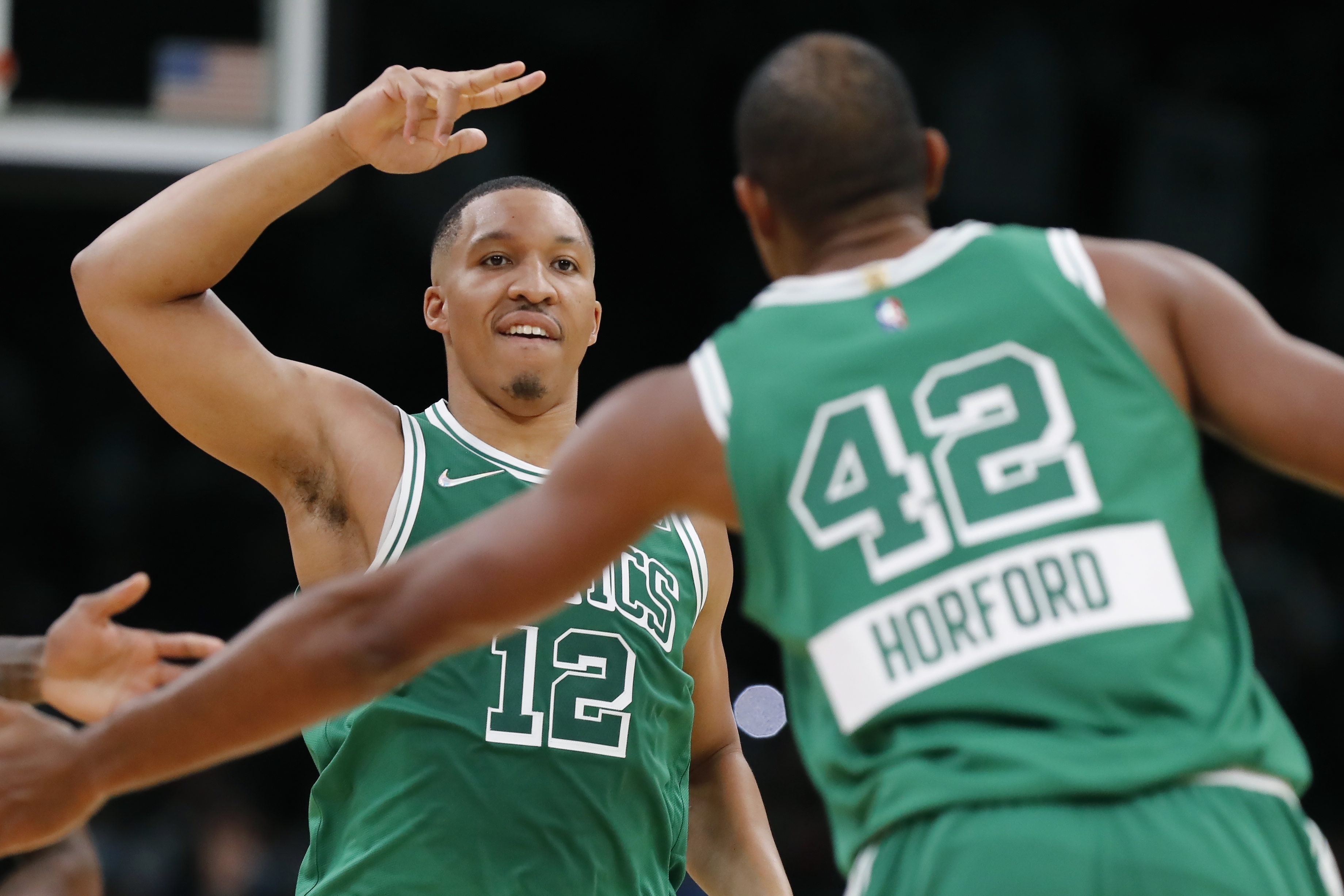 Grant Williams celebrates with Al Horford in the second half of Friday's win over the Lakers.