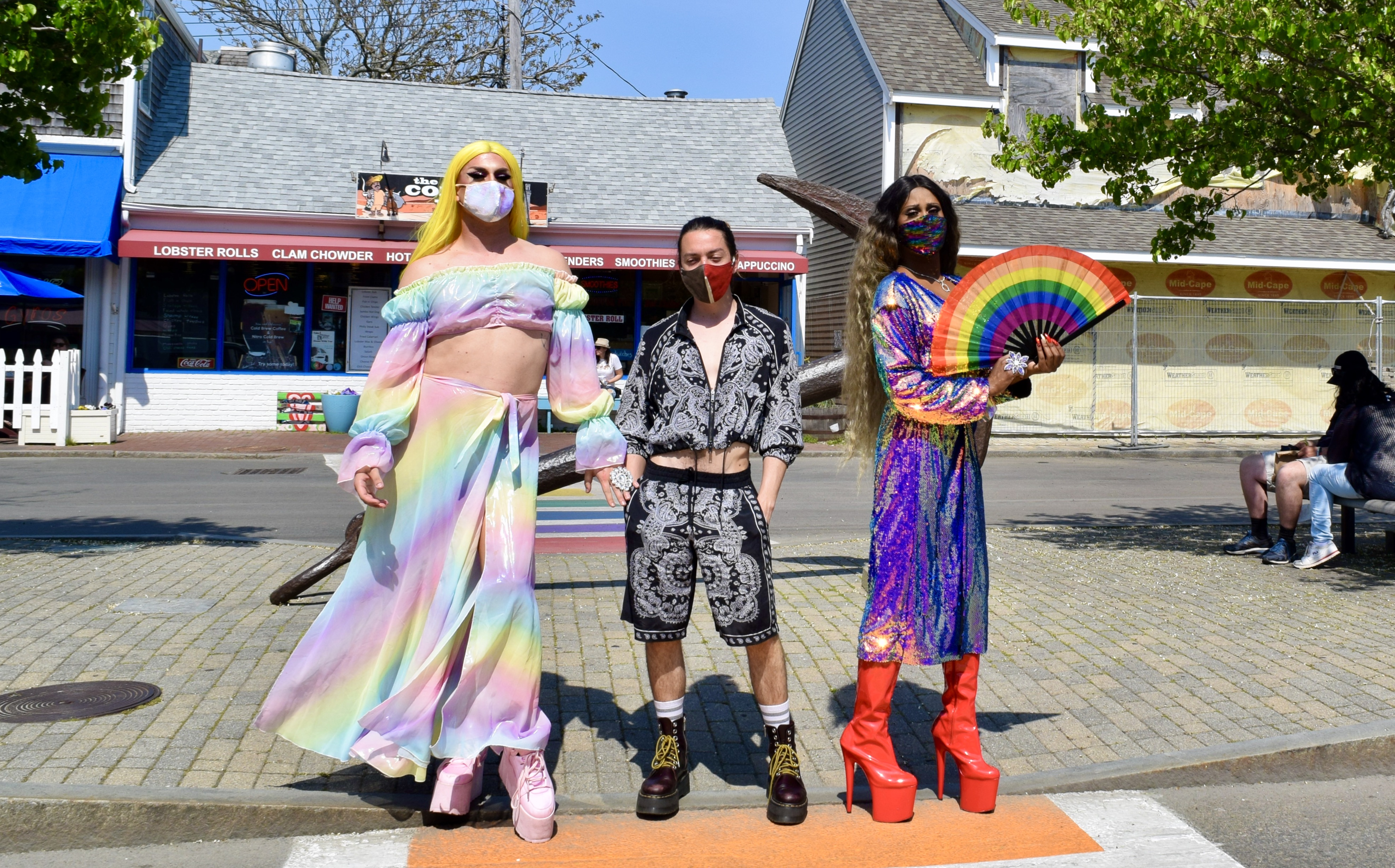 Members of the Provincetown Queer Council, Mackenzie, João Santos, and Qya Cristál (pictured here before the mask mandate was lifted), will help visitors find activities and parties this summer.