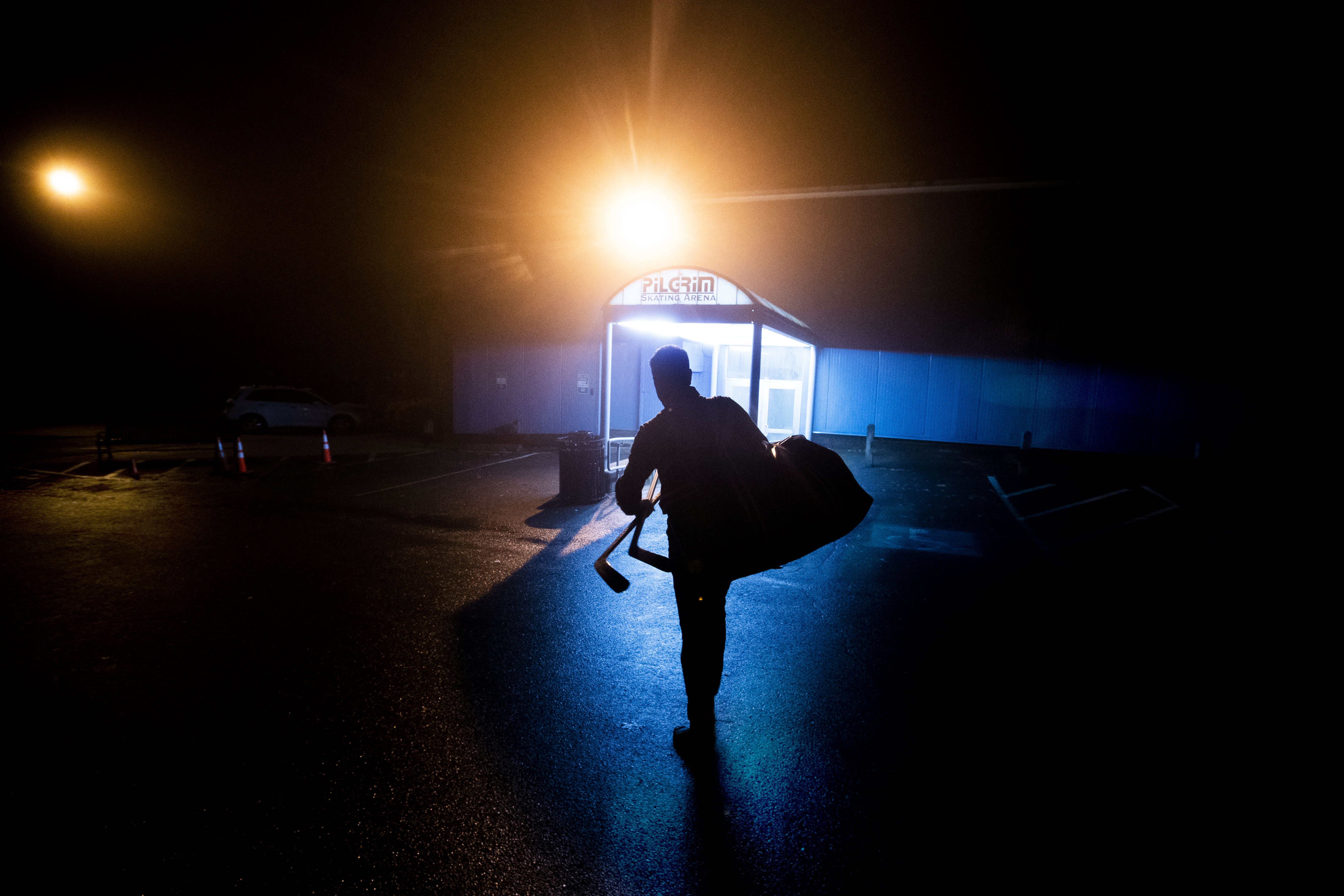 A player arrived before dawn at the Pilgrim Hockey Arena in Hingham to participate in Has Been Hockey. Four teams rotate playing each other using two rinks. Games start at 6:30 a.m.