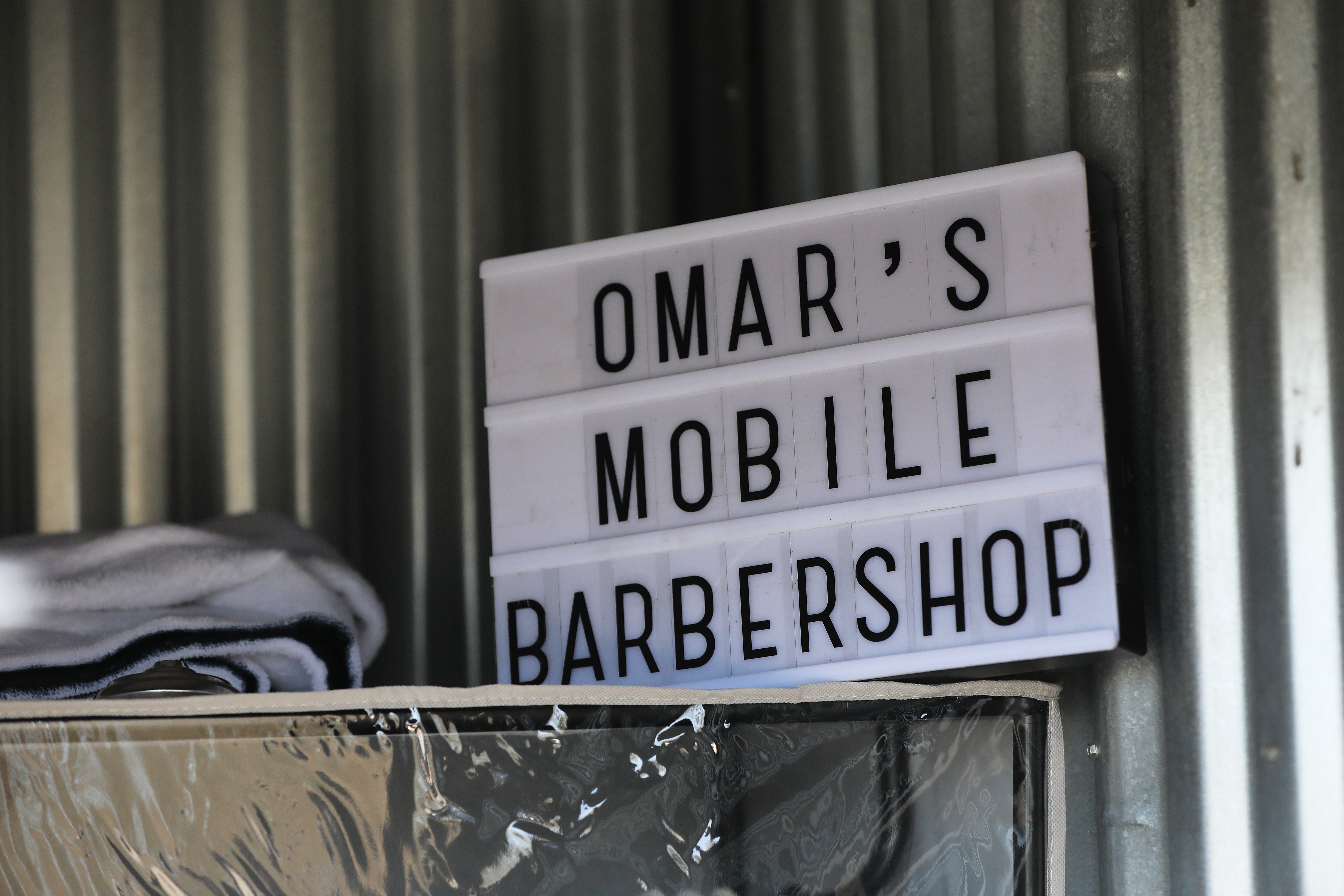 Carlos Omar Montes keeps all the equipment and supplies for his mobile barbershop in a 5' X 5' storage unit in Ashland.