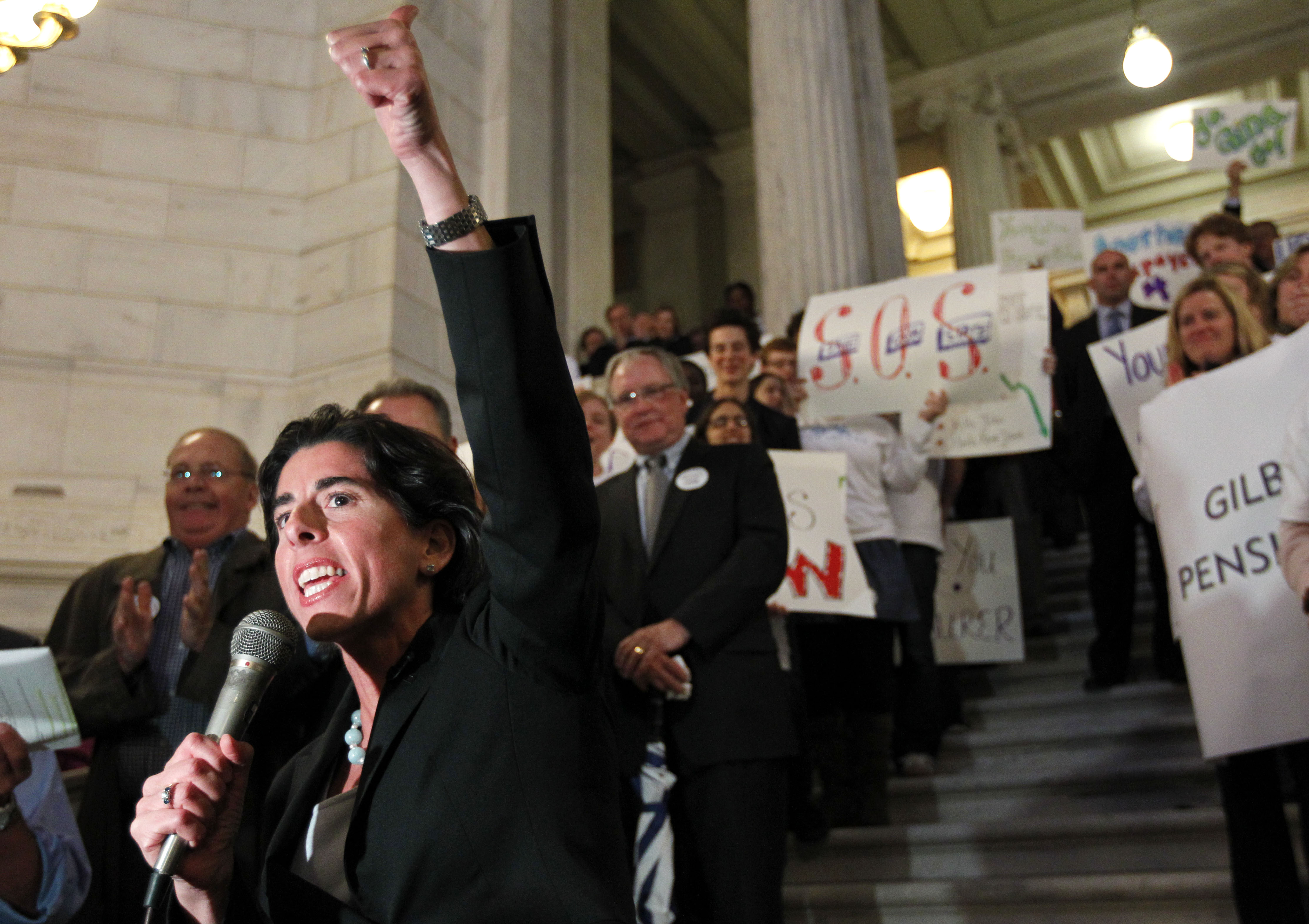 Gina M. Raimondo, then Rhode Island general treasurer, receives applause as she addresses a rally of supporters for her pension legislation at the State House in October 2011.
