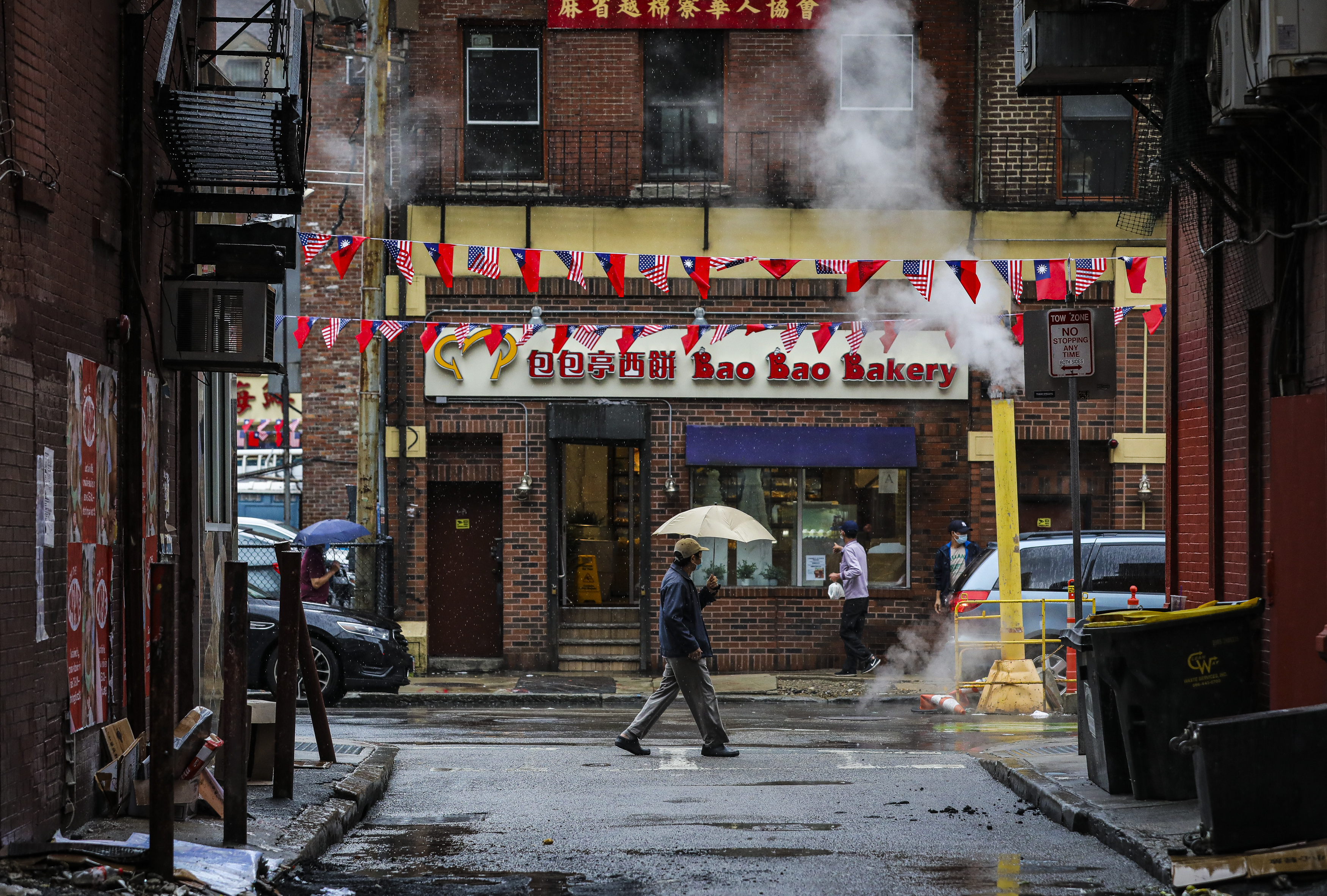 A pedestrian walks through Chinatown, our restaurant neighborhood of the year.