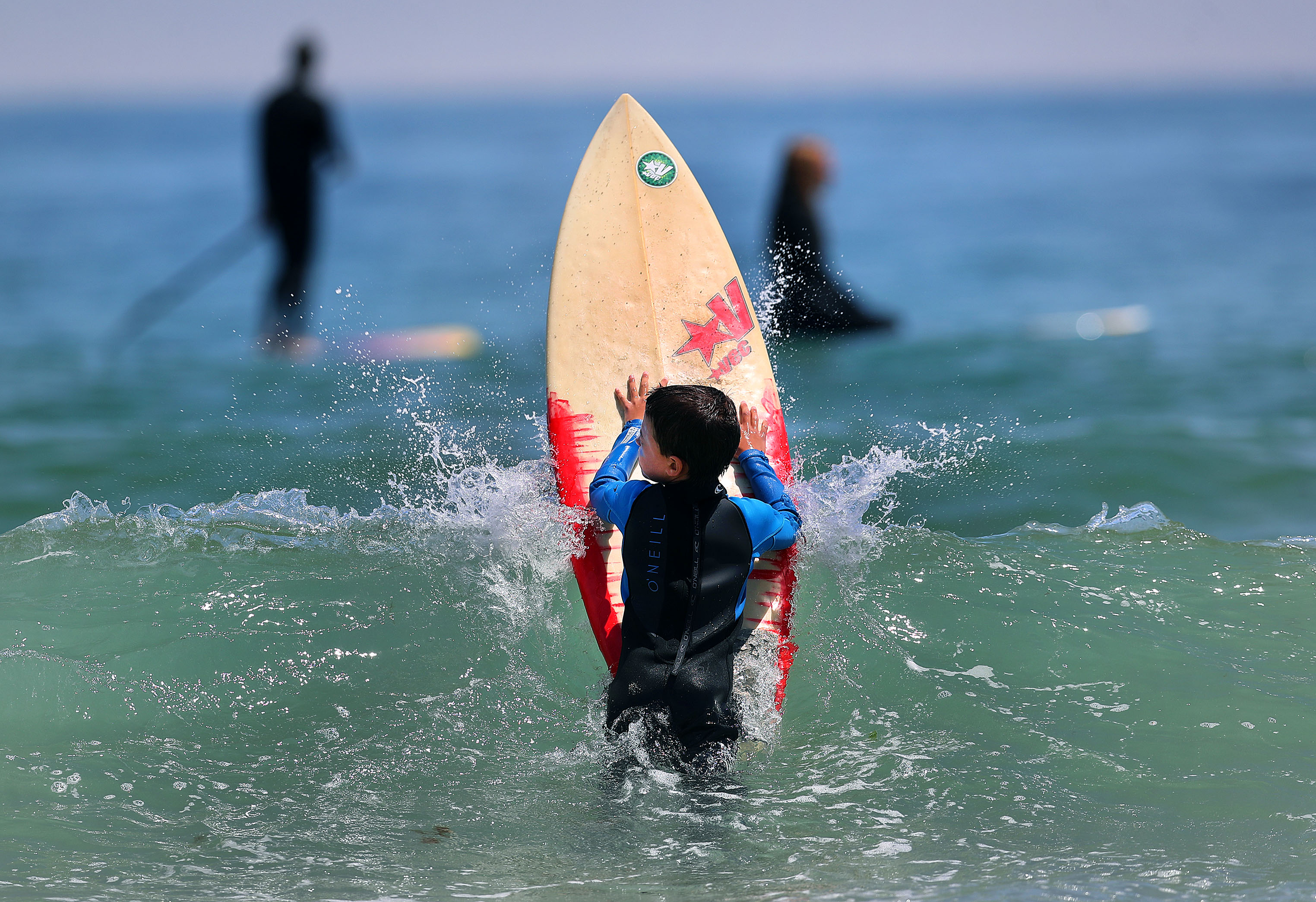 Wellfleet’s Newcomb Hollow Beach was filled with surfers and beachgoers, including 9-year-old Aiden O’Dell, on June 27, despite shark warnings.