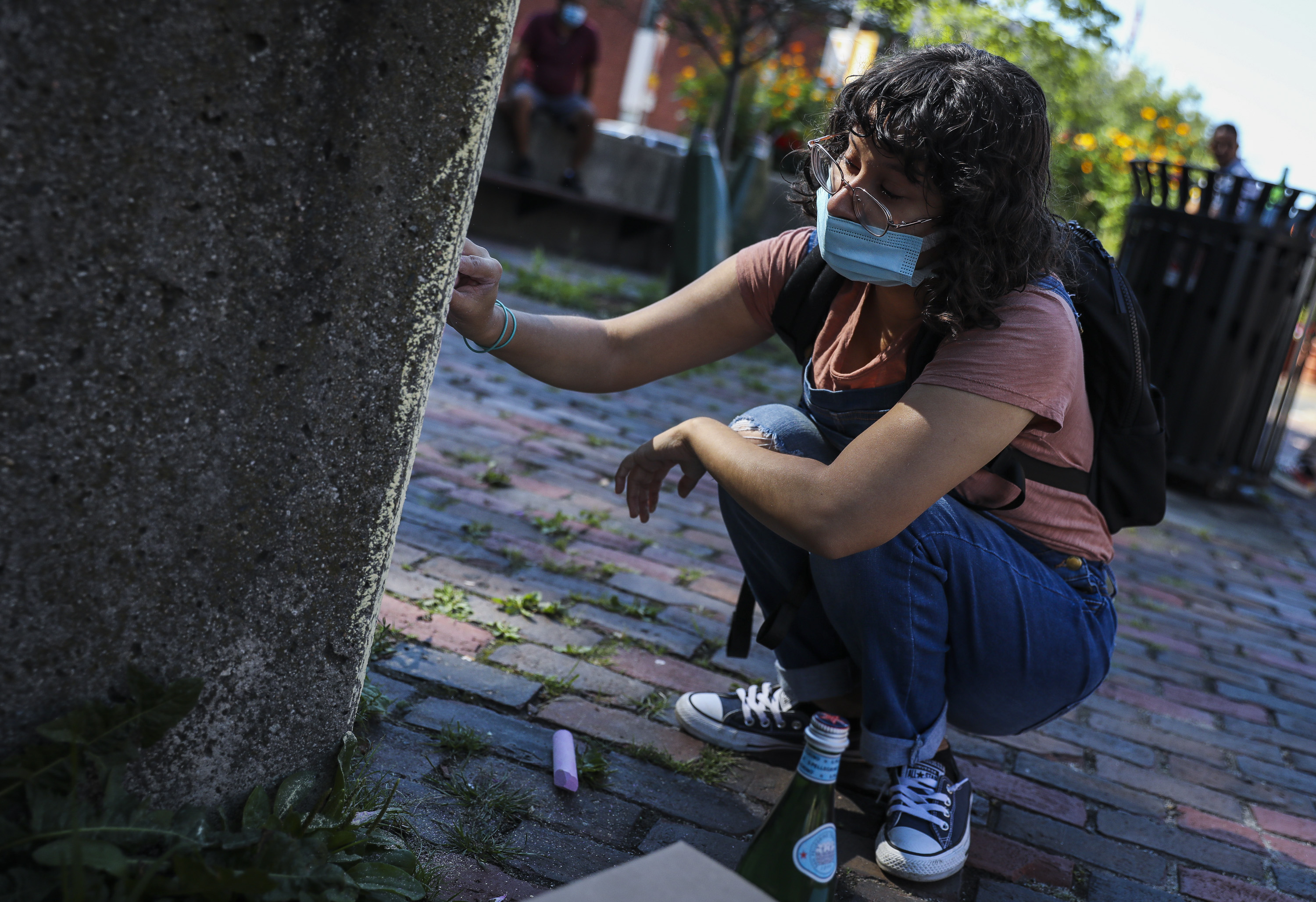 Vidal worked on a chalk mural in Chelsea Square.
