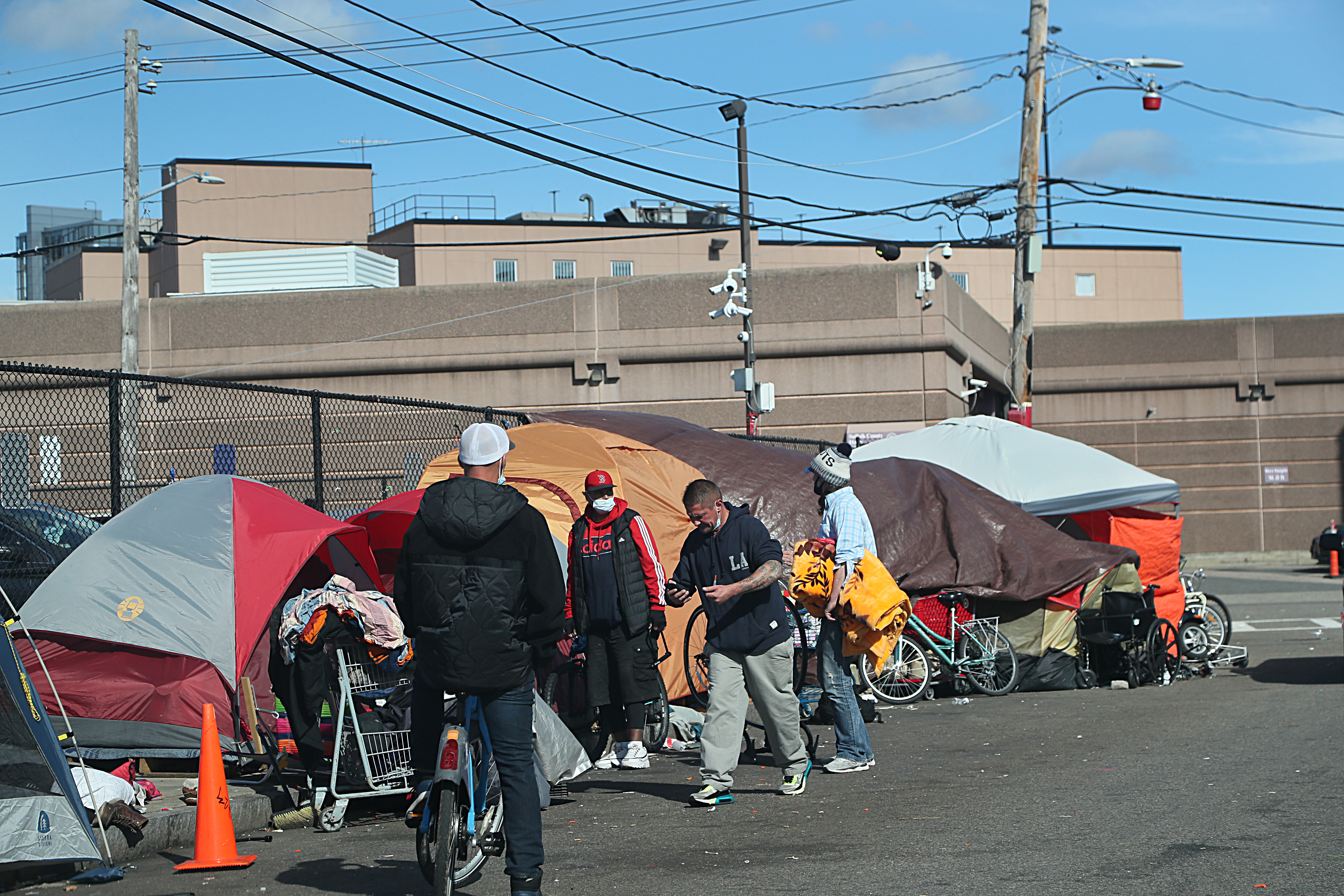 Building 8 at the Suffolk County House of Correction, in the background, is visible from the tent encampment on Topeka Street at Mass and Cass.