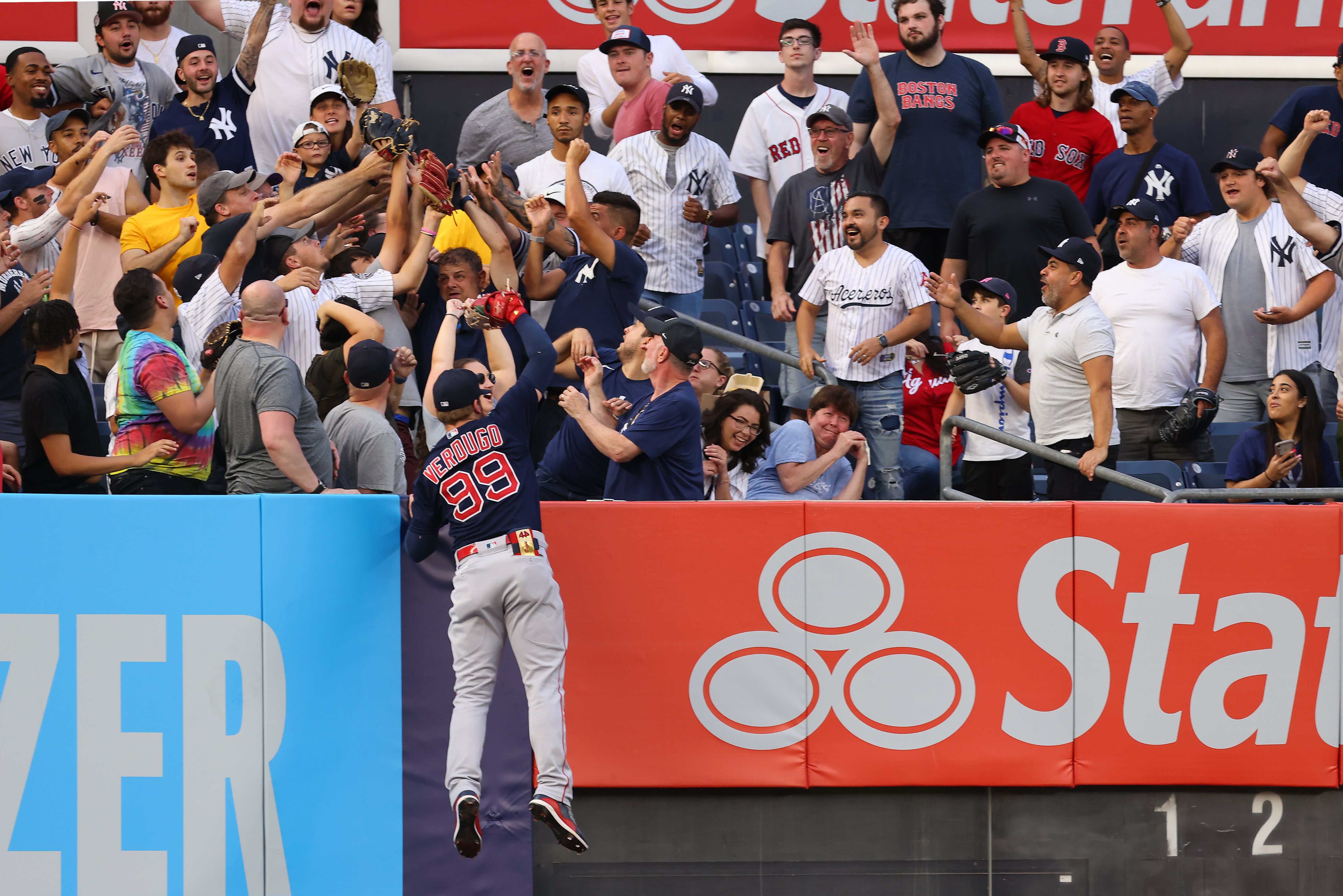 Alex Verdugo tries to reach this one off the bat of Gleyber Torres, but he comes up short in the second inning of Sunday's contest.