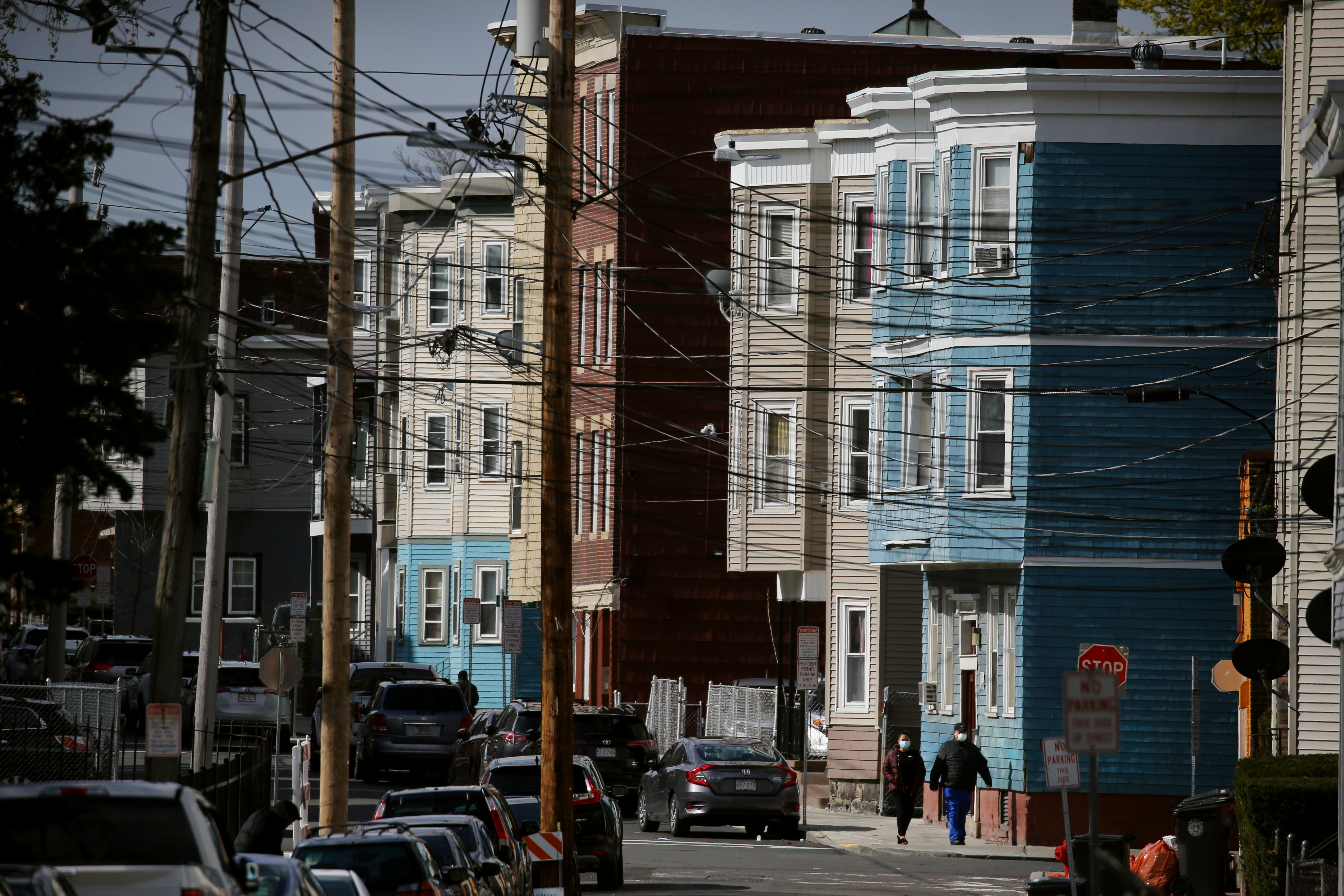 Pedestrians walk on Shamus Street in Chelsea in April.
