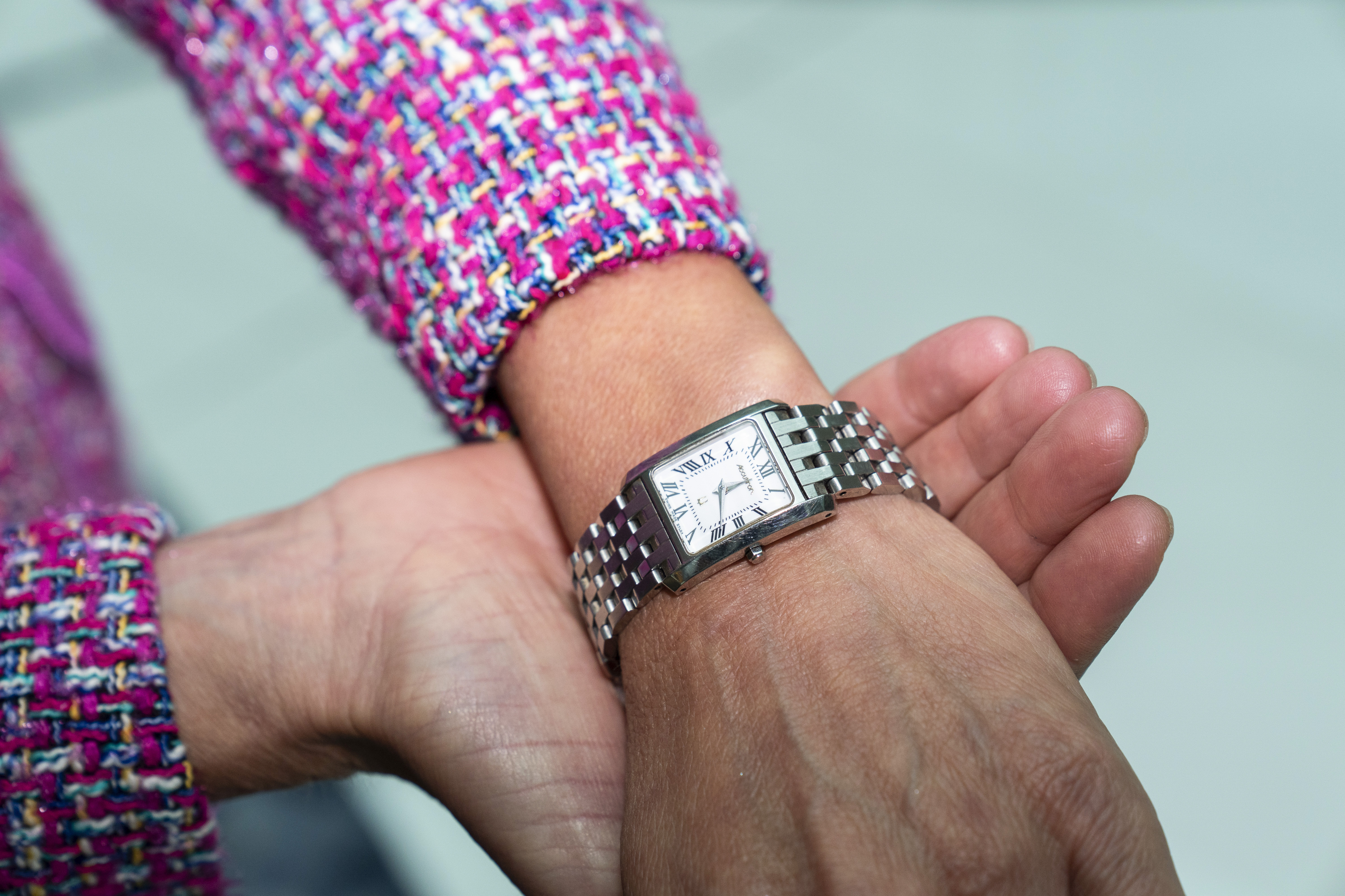 In this Tuesday, Sept. 28, 2021, photo Commerce Secretary Gina Raimondo poses for a photograph with her Bulova watch. Raimondo only wears watches made by Bulova — a company that fired her scientist father, closed its Rhode Island factory and moved production to China in 1983. “It’s been a tribute to my dad," Raimondo said in an interview, “and a reminder to me that we need to do more to get good manufacturing jobs in America.”