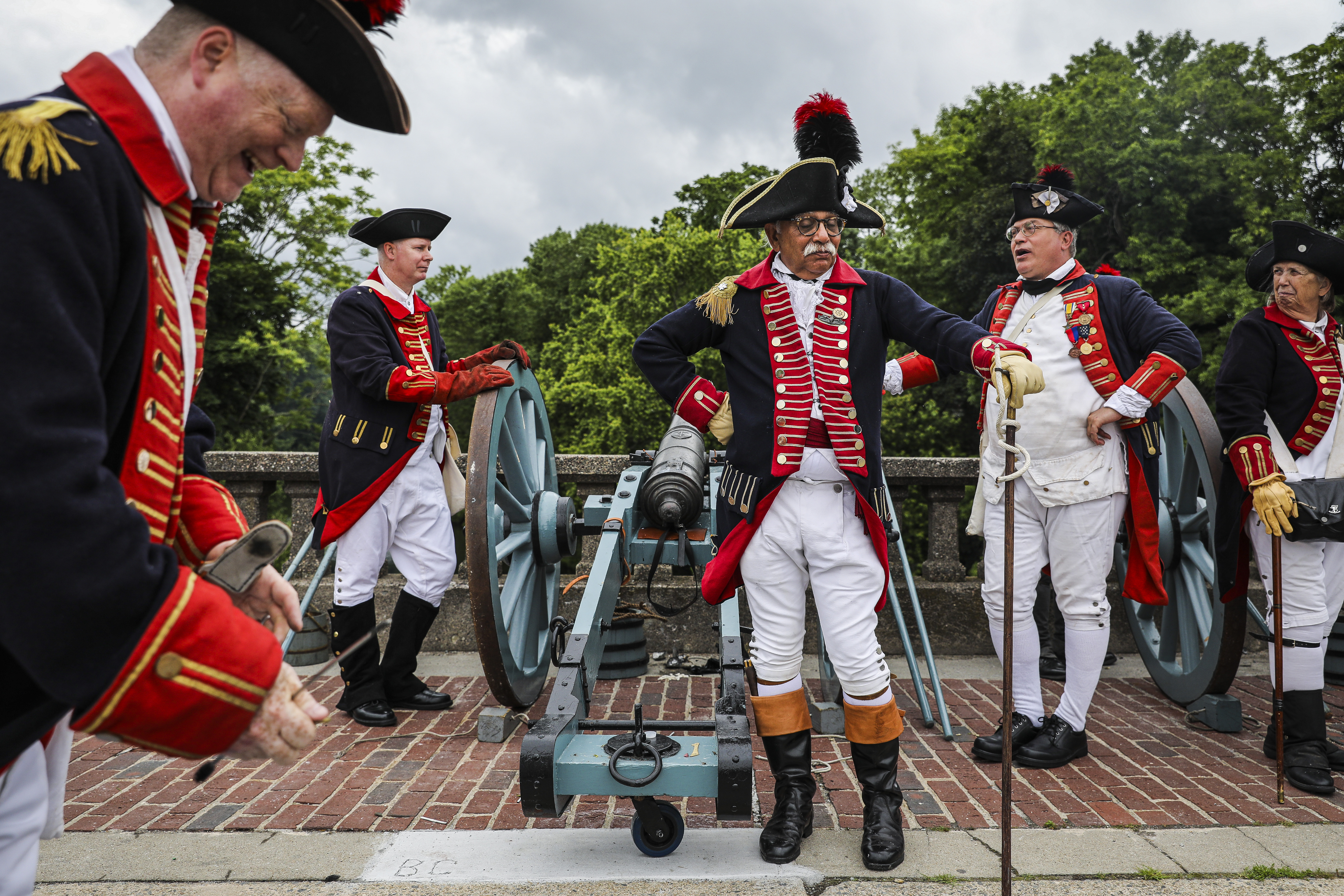 JUNE 12, WARWICK  —  Gaspee Days is a very popular celebration in Rhode Island marking a little-known piece of resistance history. I’m walking along the parade route and start hearing cannons going off. These guys dressed up in reenactment outfits were on this bridge shooting into the creek. The cannons were actually made by Paul Revere in the 1790s, so they were very proud of them, as they should be. They fired it off when I happened to be standing five feet away. It was so loud and jarring, I jumped. I don’t even think I got that shot. – Erin Clark