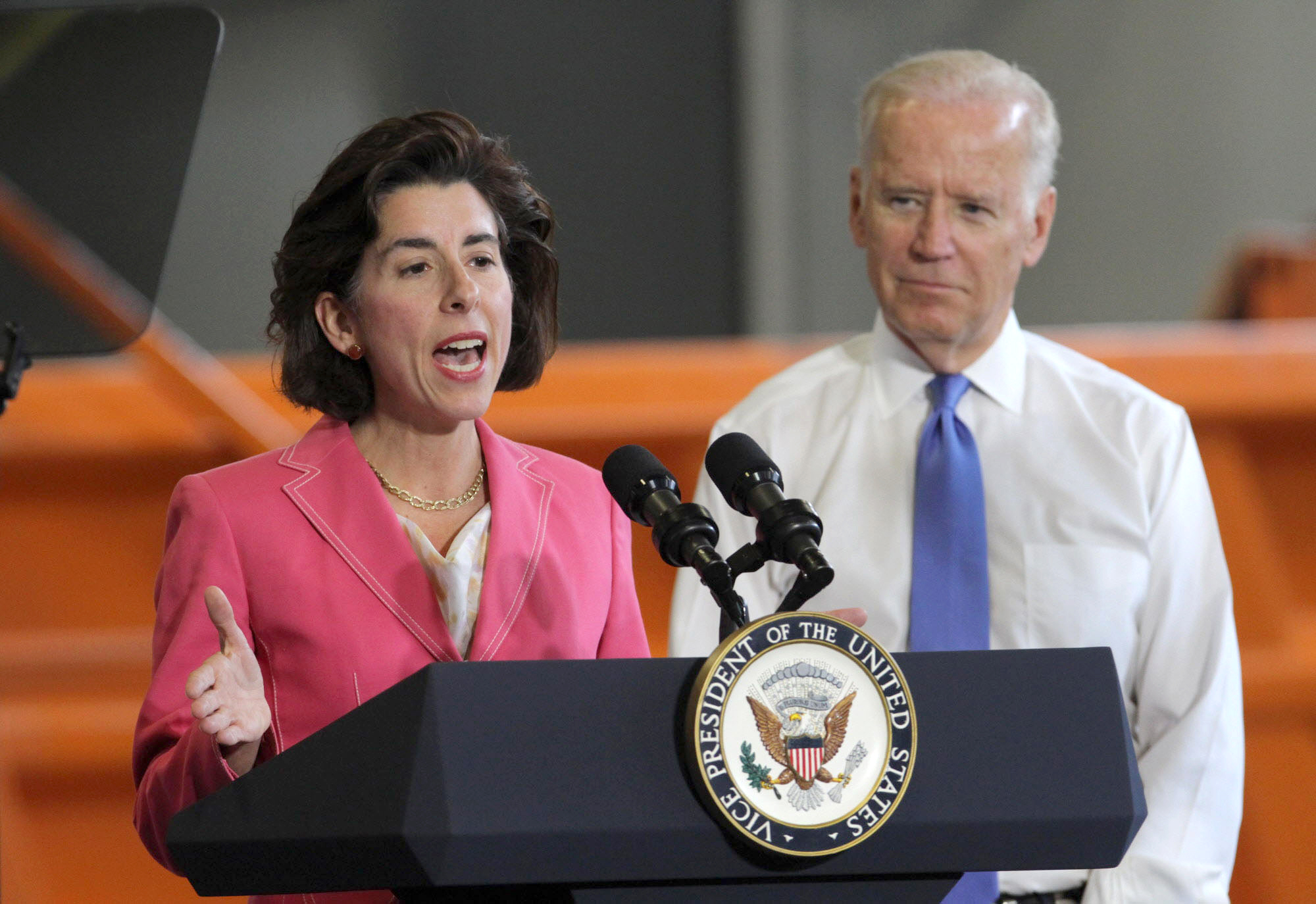 In 2016, then-Vice President Joe Biden listened to Rhode Island's then-Governor Gina Raimondo speak during a visit to a RI DOT facility in East Providence.