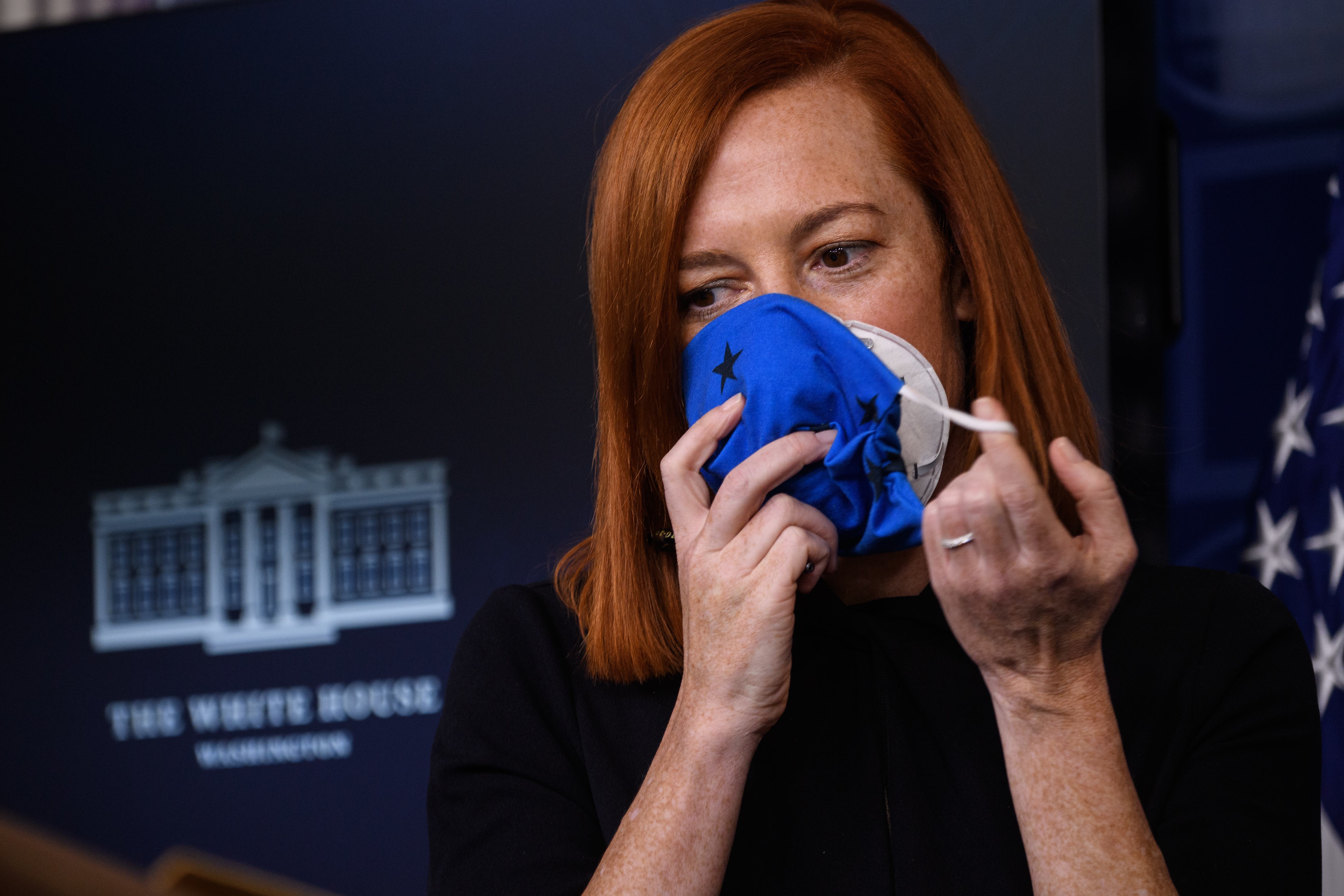 White House press secretary Jen Psaki took off her two masks before a press briefing this week.