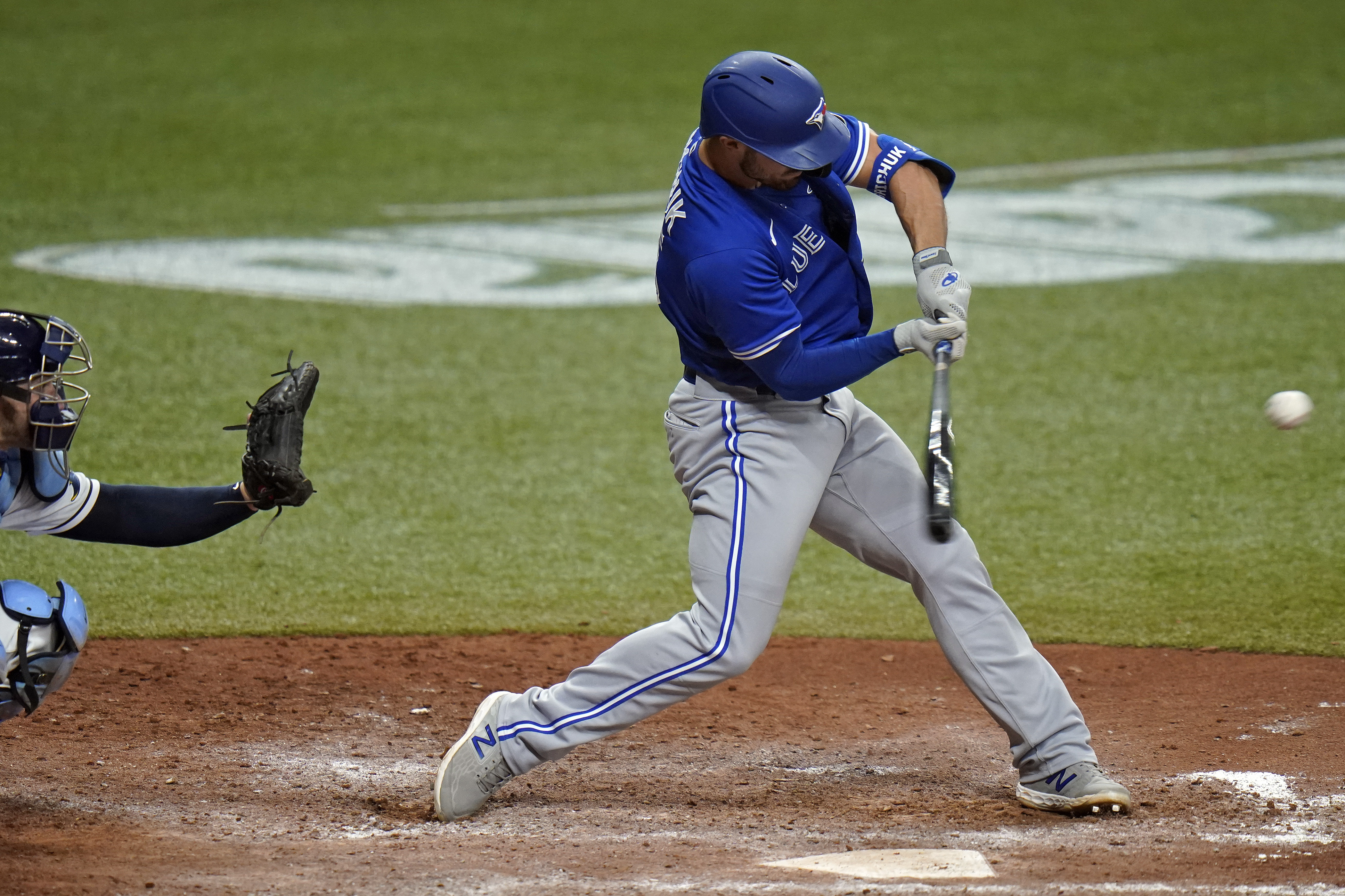 Toronto's Randal Grichuk blasts a three-run homer in the seventh inning of Monday's game.