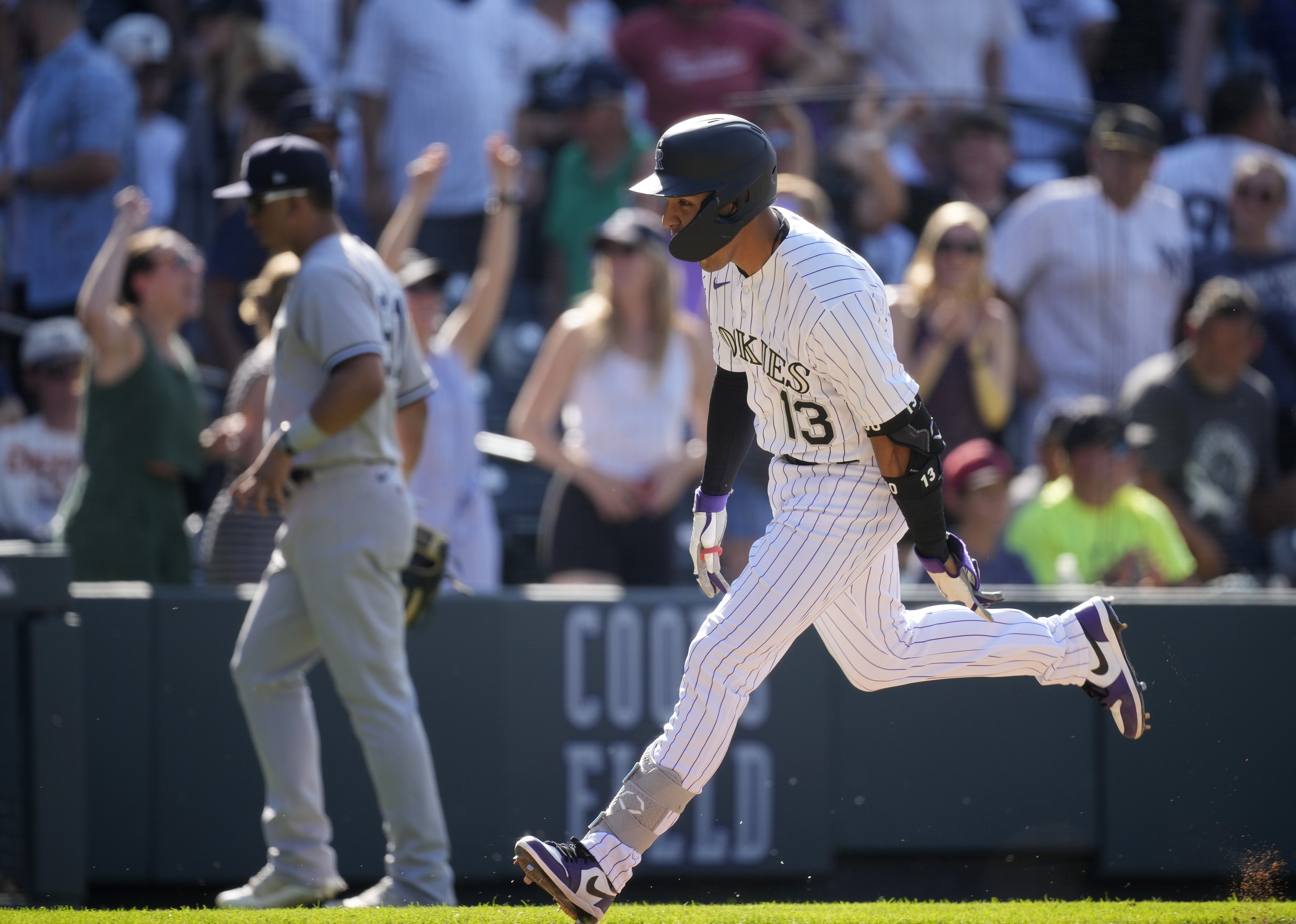 DENVER, CO - JULY 15: New York Yankees second baseman Gleyber Torres (25)  runs after hitting a first inning triple during a game between the New York  Yankees and the Colorado Rockies