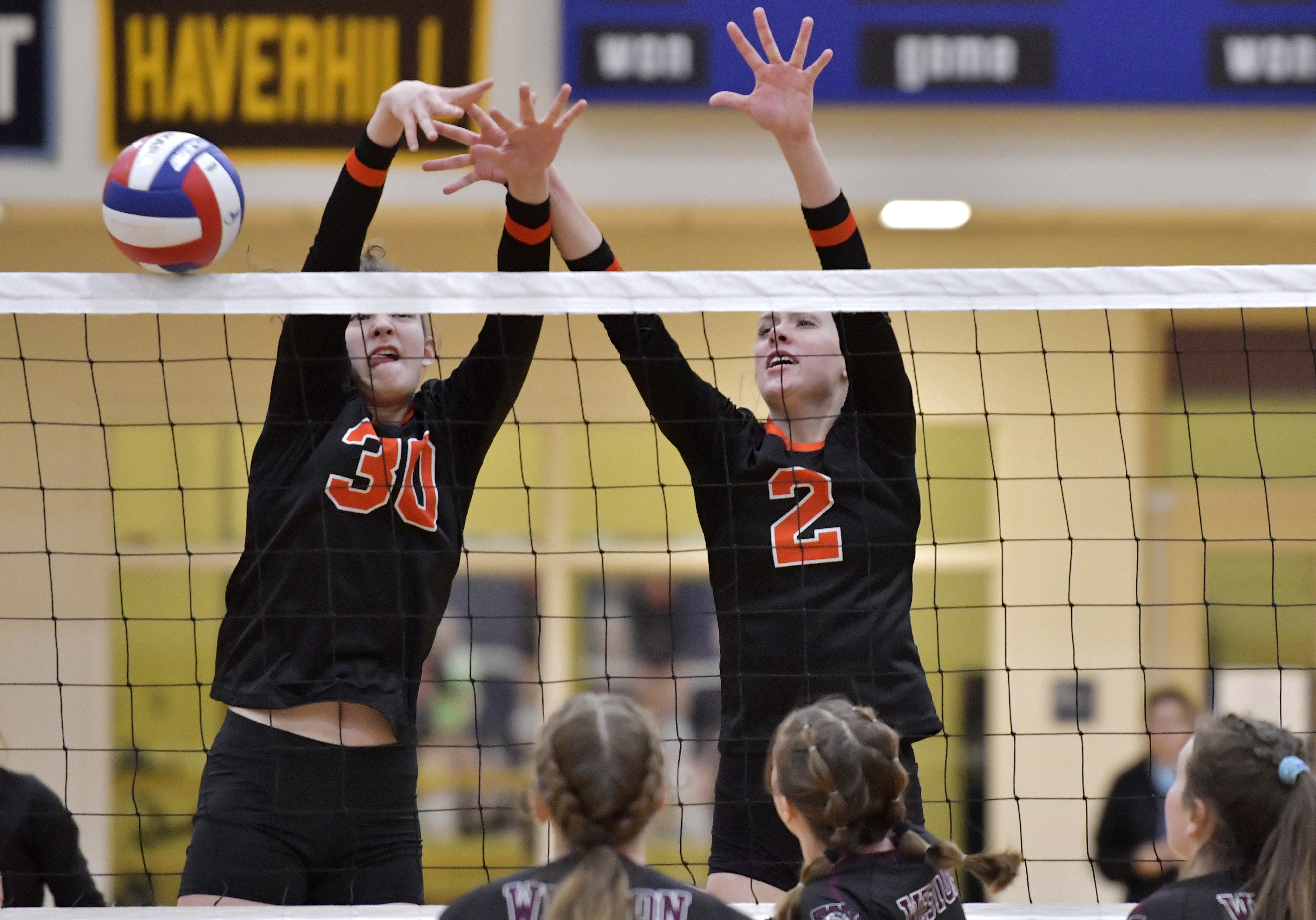 With every ounce of energy, Ipswich girls' volleyball nets three